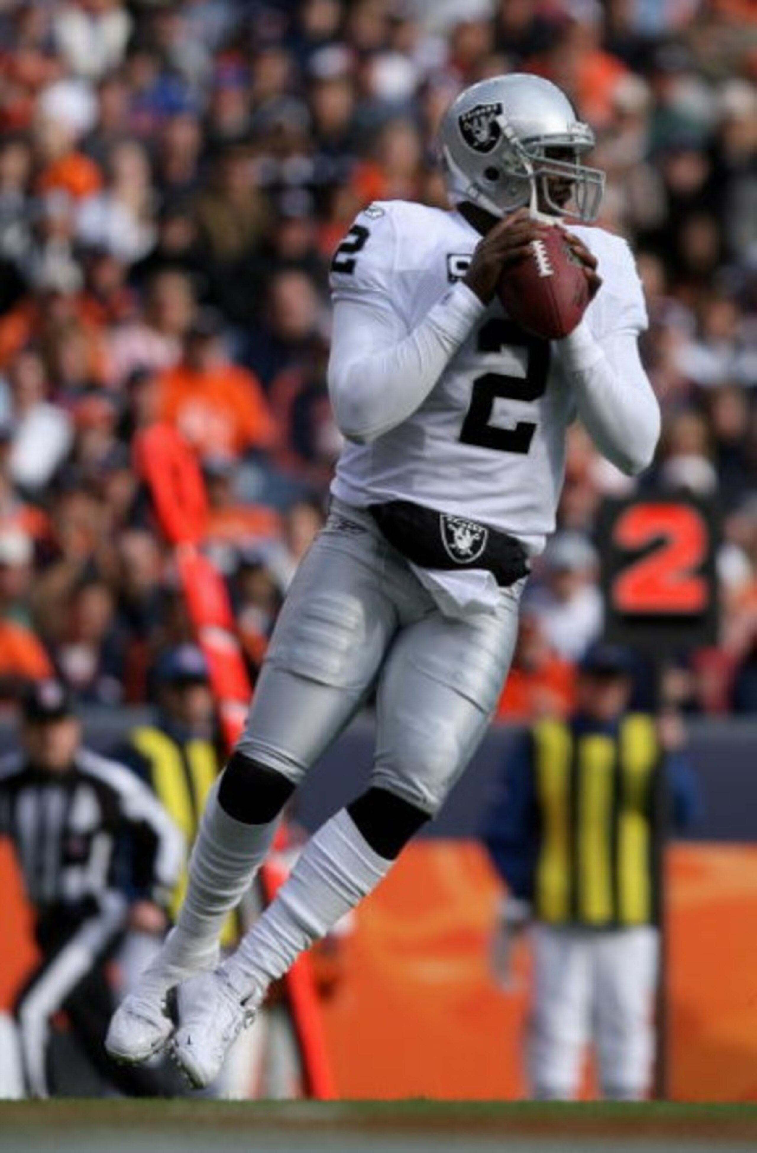 DENVER - NOVEMBER 23:  Quarterback JaMarcus Russell #2 of the Oakland Raiders delivers a pass against the Denver Broncos during week 12 NFL action at Invesco Field at Mile High on November 23, 2008 in Denver, Colorado. The Raiders defeated the Broncos 31-