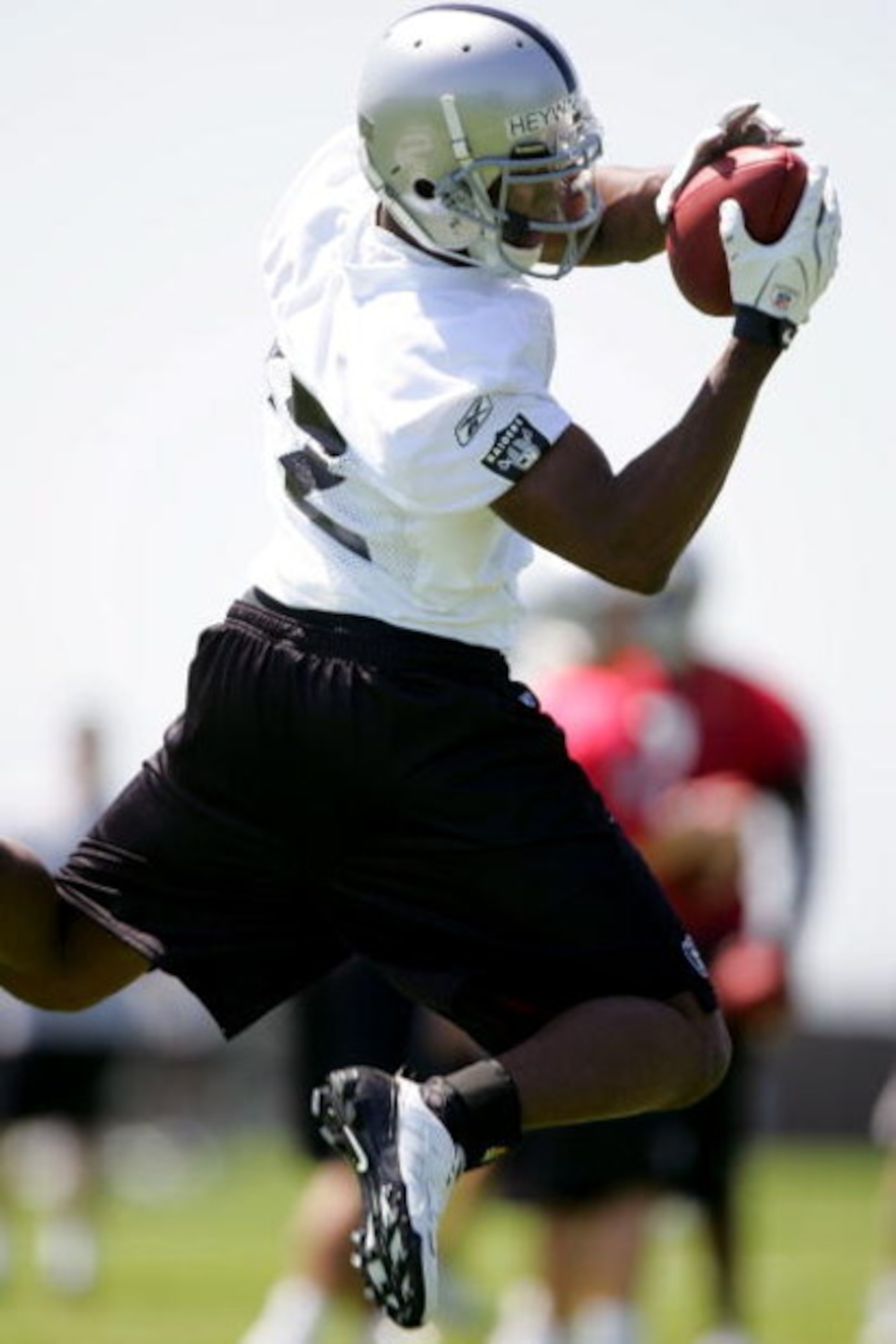 ALAMEDA, CA - MAY 08:  Darrius Heyward-Bey #12 of the Oakland Raiders runs drills during the Raiders minicamp at the team's permanent training facility on May 8, 2009 in Alameda, California.  (Photo by Ezra Shaw/Getty Images)