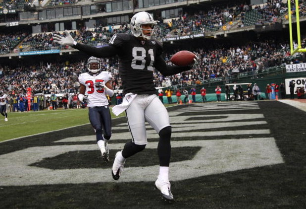 OAKLAND, CA - DECEMBER 21: Chaz Schilens #81 of the Oakland Raiders celebrates scoring a touchdown past Jacques Reeves #35 of the Houston Texans during an NFL game on December 21, 2008 at the Oakland-Alameda County Coliseum in Oakland, California.  (Photo