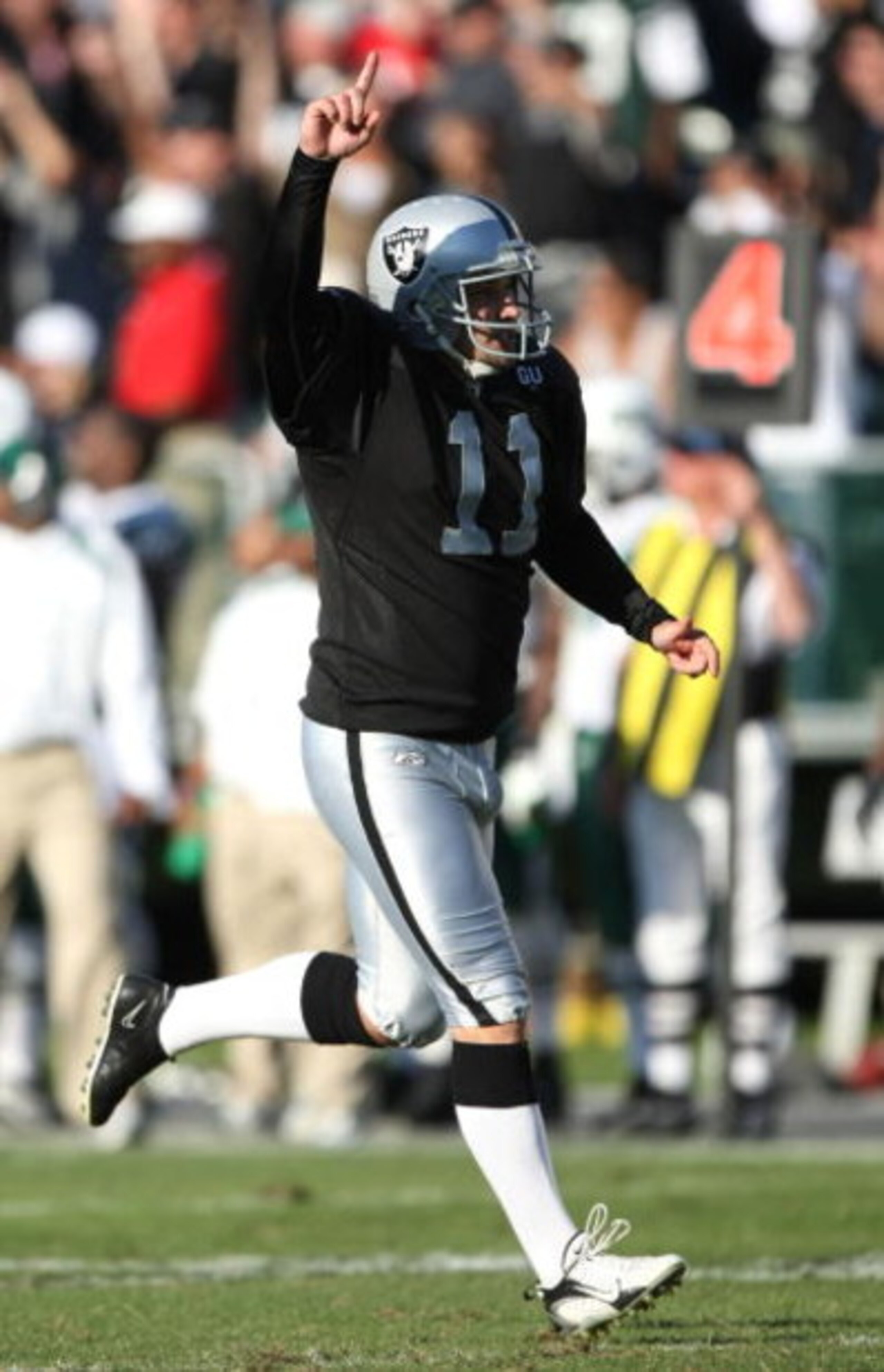 OAKLAND, CA - OCTOBER 19:  Sebastian Janikowski #11 of the Oakland Raiders celebrates after kicking a 57 yard field goal in overtime against the New York Jets during an NFL game on October 19, 2008 at the Oakland-Alameda County Coliseum in Oakland, Califo