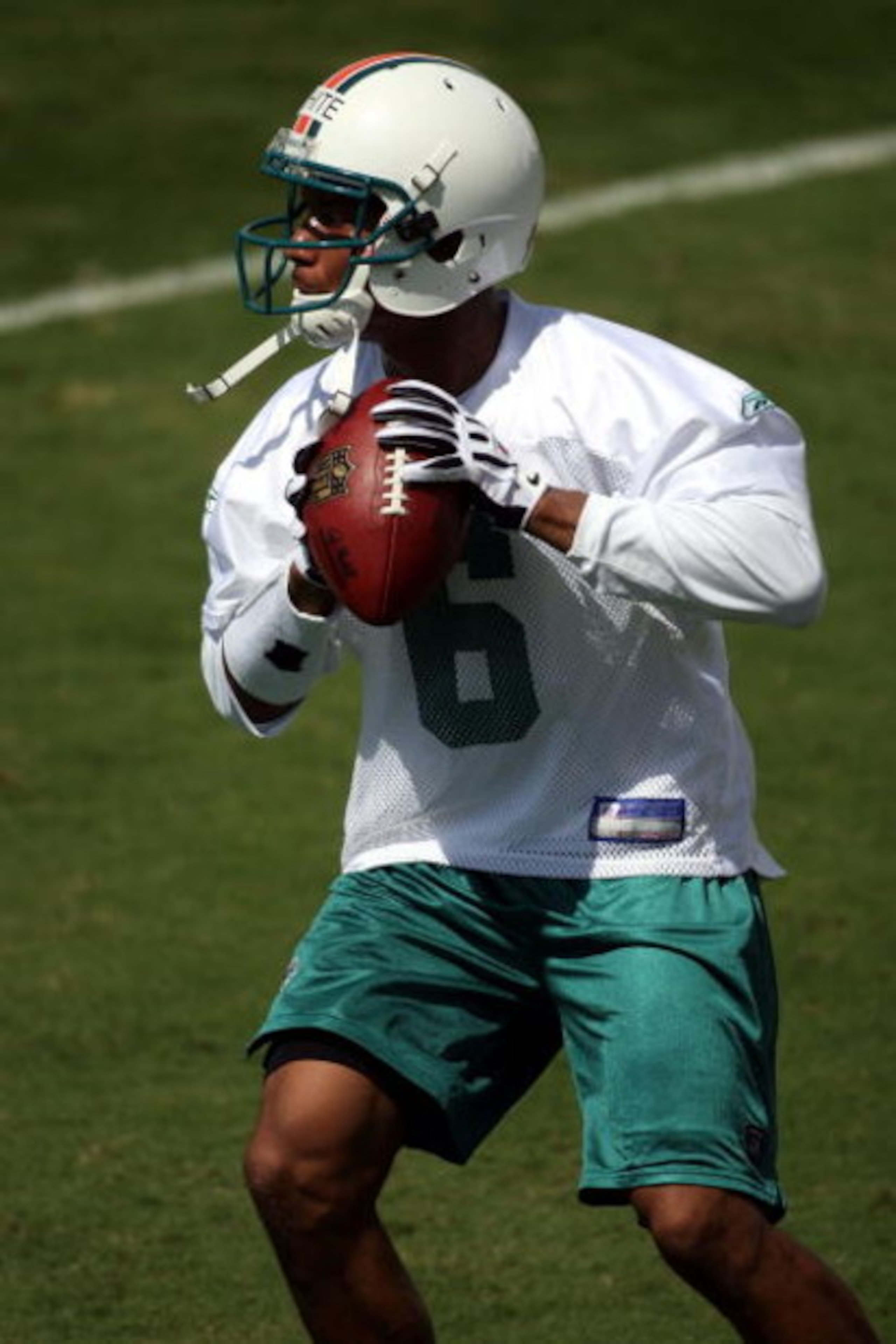 DAVIE, FL - MAY 02:  Rookie quarterback Pat White  #6 of the Miami Dolphins drops back to pass during mini camp on May 2, 2009 at the Miami Dolphins Training facility in Davie, Florida.  (Photo by Marc Serota/Getty Images)