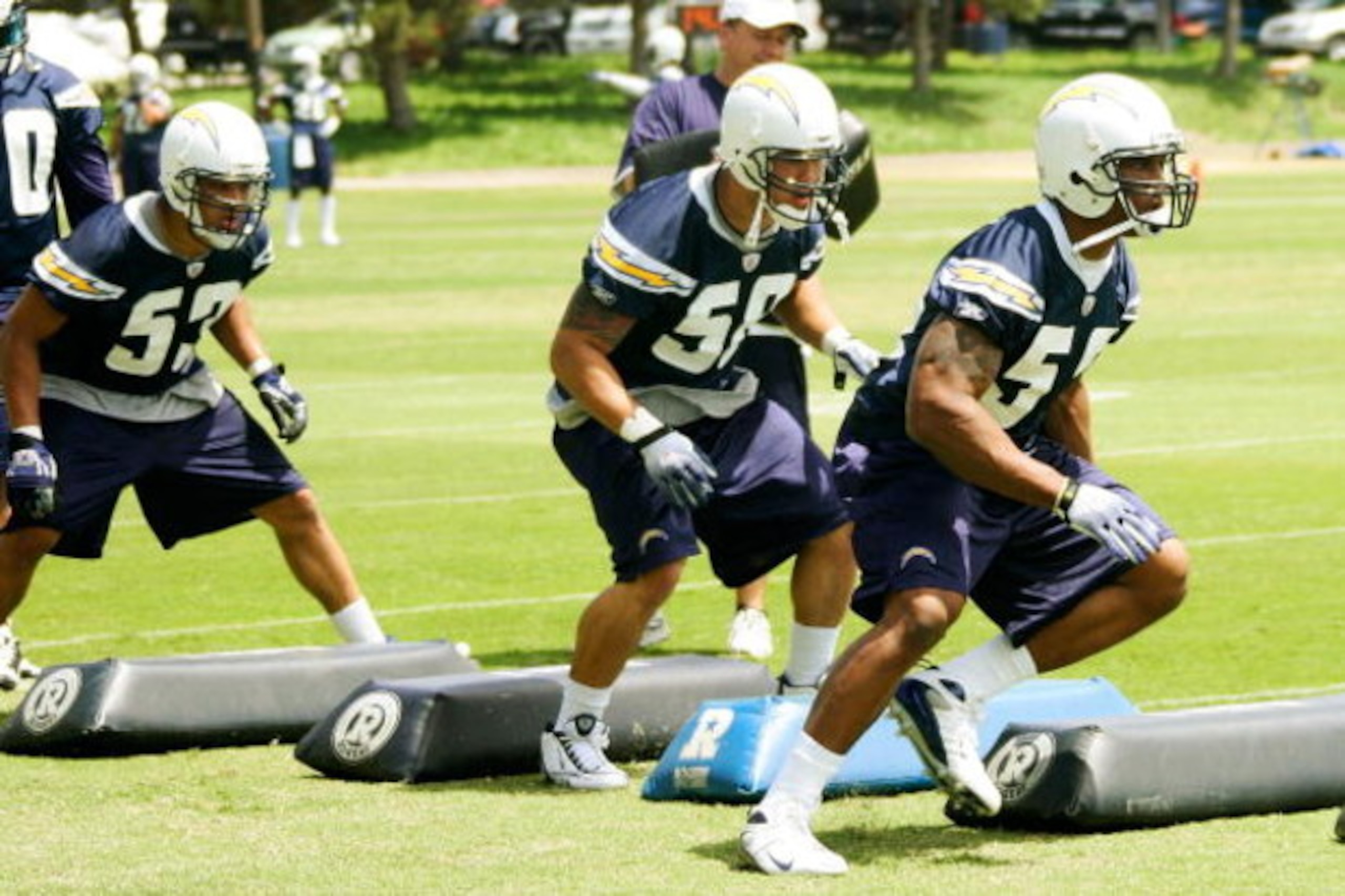 SAN DIEGO - MAY 03: Linebackers James Holt #53, Anthony Fielder #58 and Larry English #52 of the San Diego Chargers participate in a practice drill during minicamp at the Chargers training facility on May 3, 2009 in San Diego, California. (Photo by Kevin 