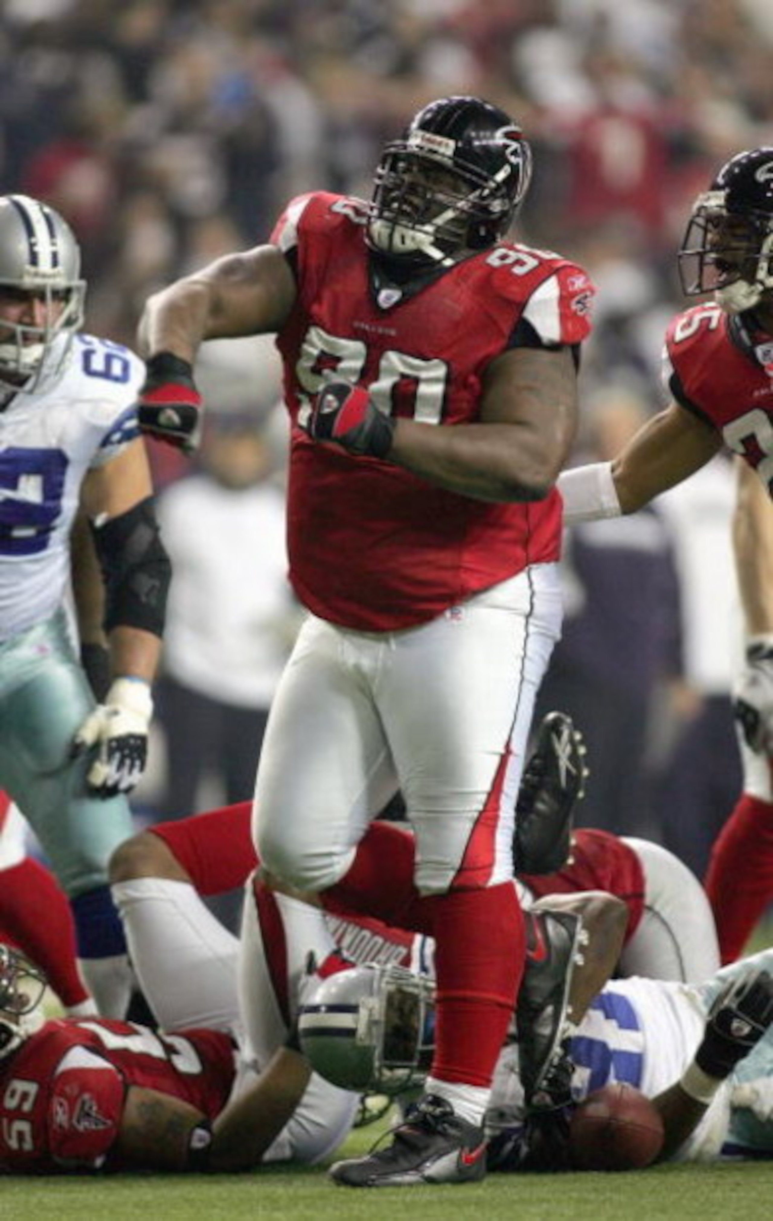 ATLANTA - DECEMBER 16: Grady Jackson #90 of the Atlanta Falcons celebrates on the field during a game against the Dallas Cowboys at the Georgia Dome on December 16, 2006 in Atlanta, Georgia. (Photo by Ronald Martinez/Getty Images)