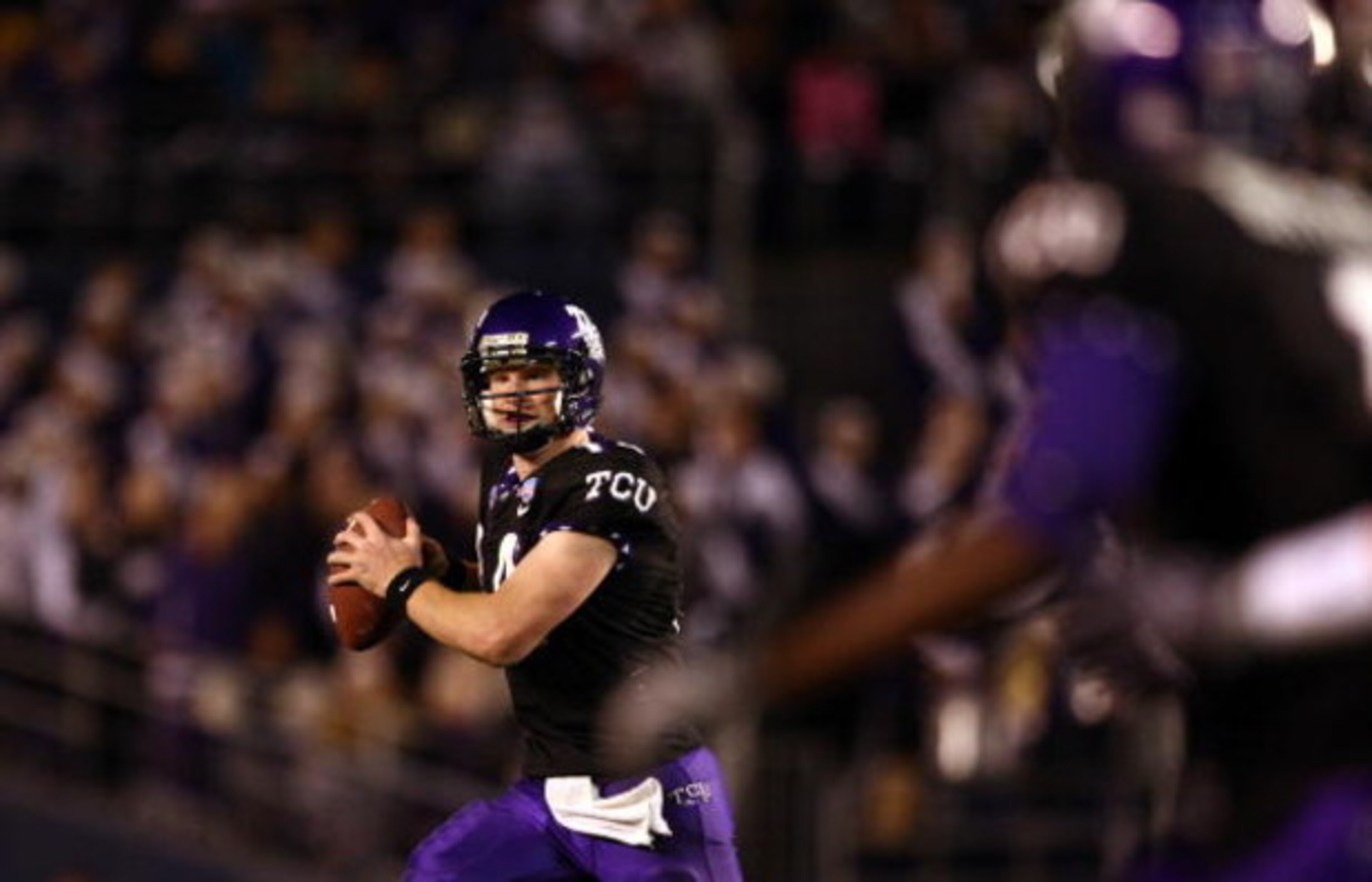 SAN DIEGO, CA - DECEMBER 23:  Quarterback Andy Dalton #14 of  TCU throws the ball against Boise State during the San Diego County Credit Union Poinsettia Bowl at Qualcomm Stadium on December 23, 2008 in San Diego, California. (Photo by Donald Miralle/Gett