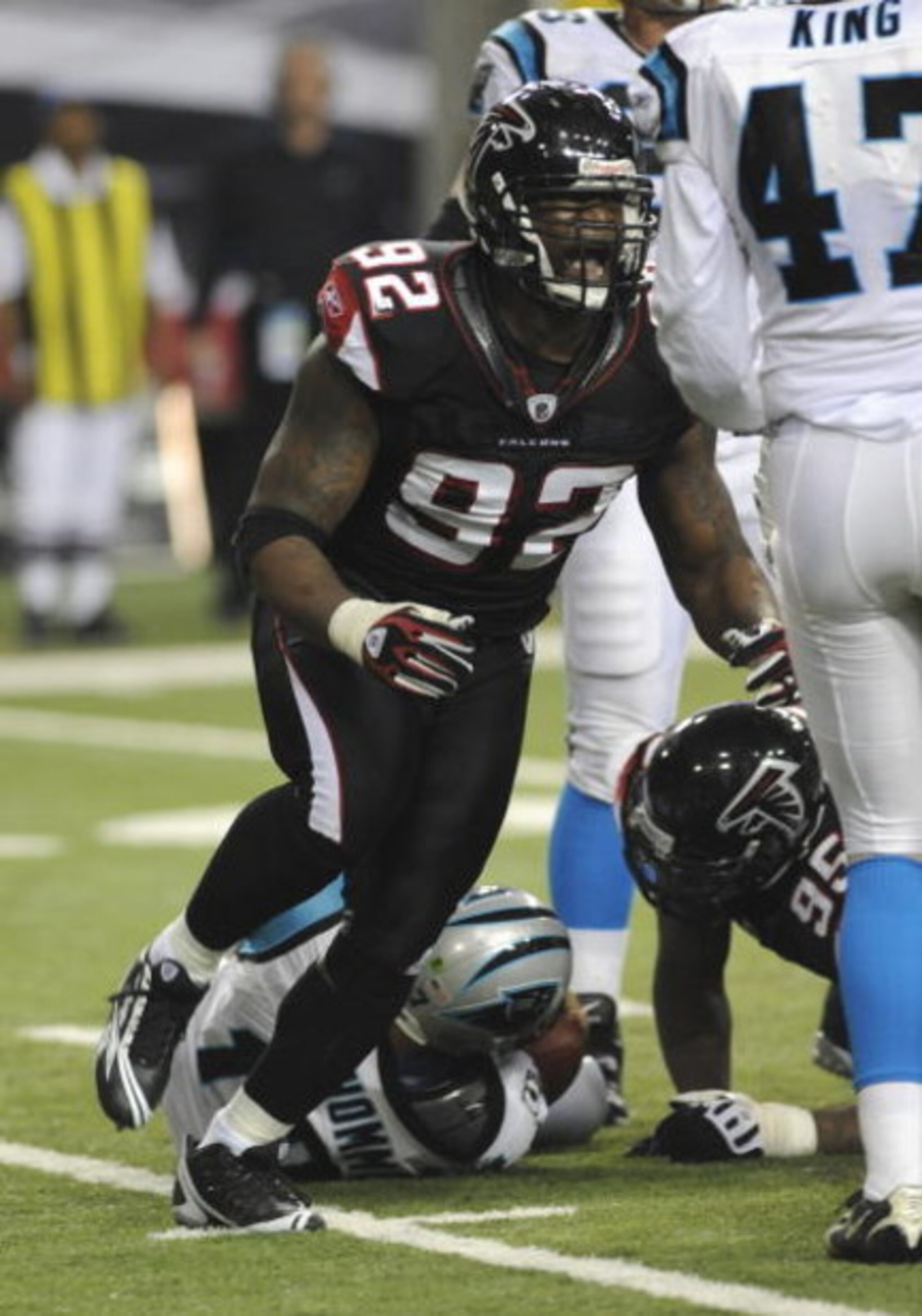 ATLANTA - NOVEMBER 23: Defensive end Chauncey Davis #92 of the Atlanta Falcons cheers a defensive play against a pass by the Carolina Panthers at the Georgia Dome on November 23, 2008 in Atlanta, Georgia.  (Photo by Al Messerschmidt/Getty Images) 