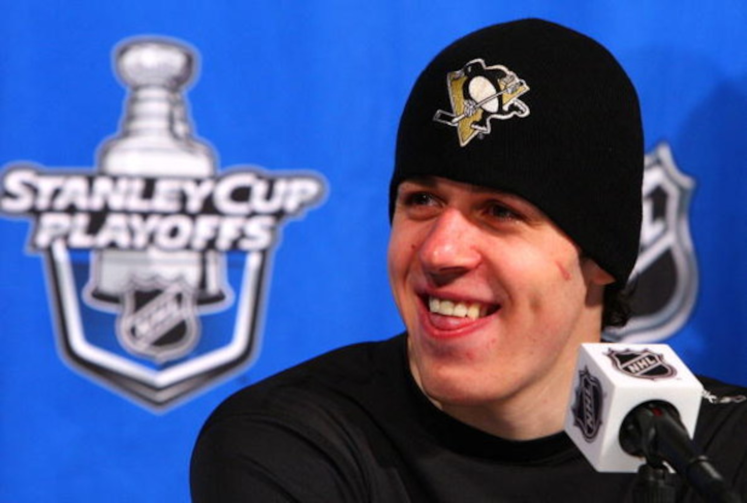 RALEIGH, NC - MAY 23:  Evgeni Malkin #71 of the Pittsburgh Penguins smiles as he talks to the media after their 6-2 win over the Carolina Hurricanes in Game Three of the Eastern Conference Championship Round of the 2009 Stanley Cup Playoffs at RBC Center 