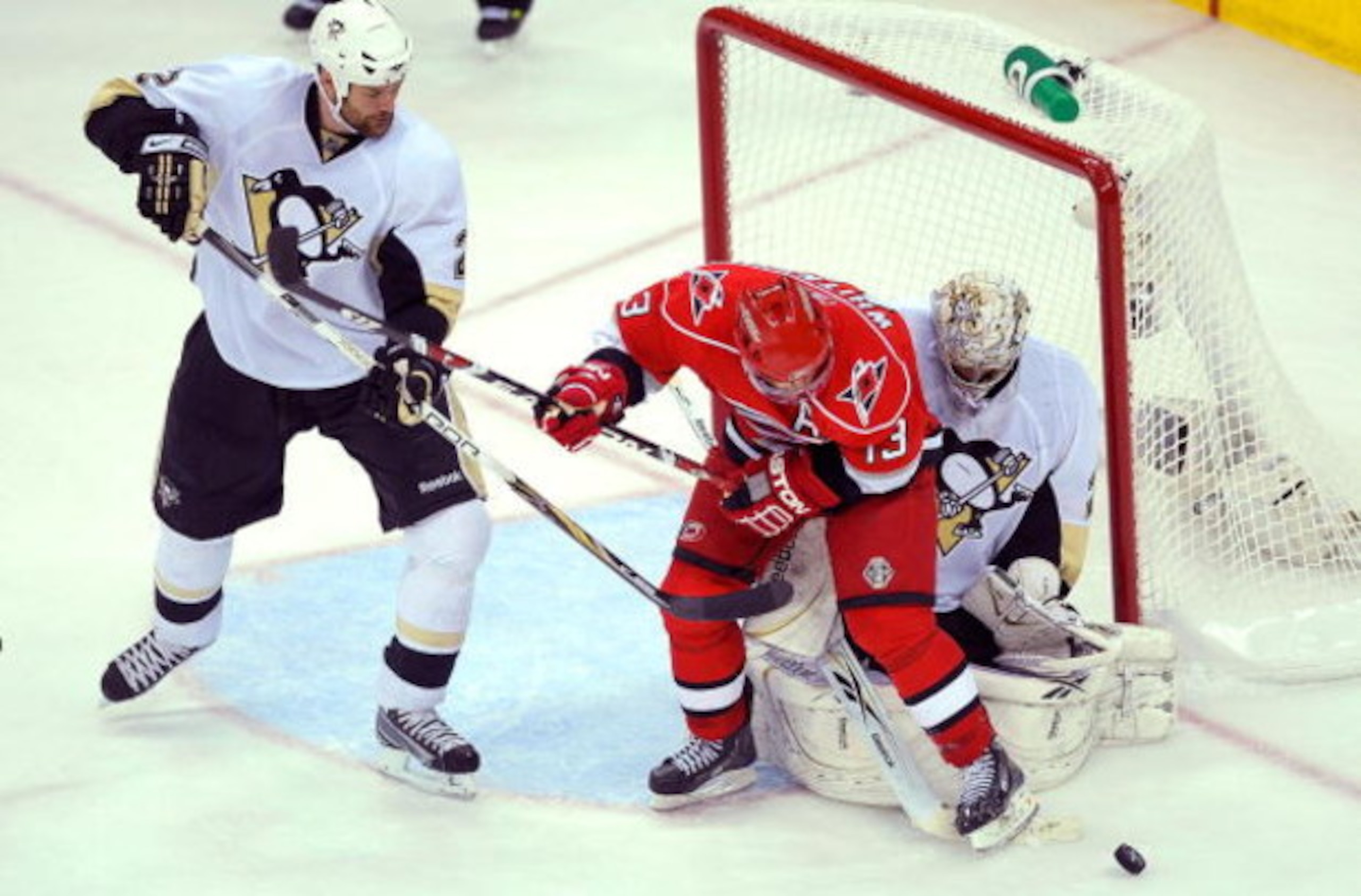 RALEIGH, NC - MAY 23:  Hal Gill #2 of the Pittsburgh Penguins defends against Ray Whitney #13 as goaltender Marc-Andre Fleury #29 protects the goal during Game Three of the Eastern Conference Championship Round of the 2009 Stanley Cup Playoffs at RBC Cent