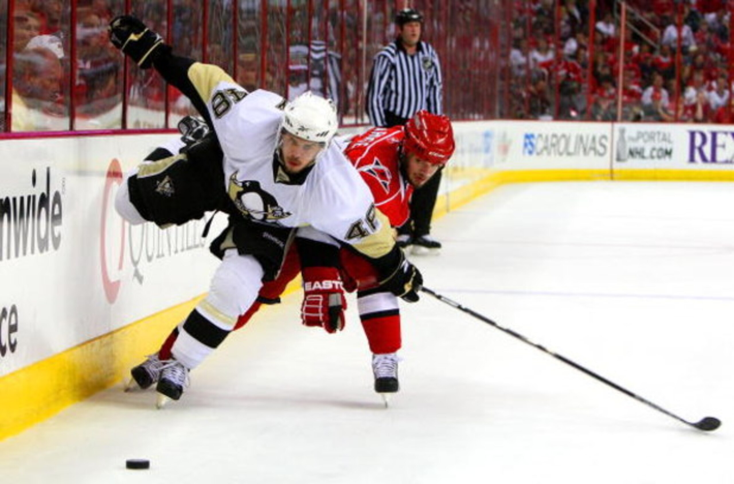 RALEIGH, NC - MAY 23:  Chad LaRose #59 of the Carolina Hurricanes battles for the puck against Tyler Kennedy #48 of the Pittsburgh Penguins during Game Three of the Eastern Conference Championship Round of the 2009 Stanley Cup Playoffs at RBC Center on Ma
