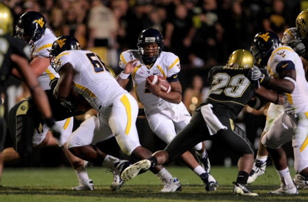 BOULDER, CO - SEPTEMBER 18:  Quarterback Pat White #5 of the West Virginia Mountaineers rushes against the Colorado Buffaloes at Folsom Field September 18, 2008 in Boulder, Colorado. Colorado defeated West Virginia 17-14 in overtime.  (Photo by Doug Pensi