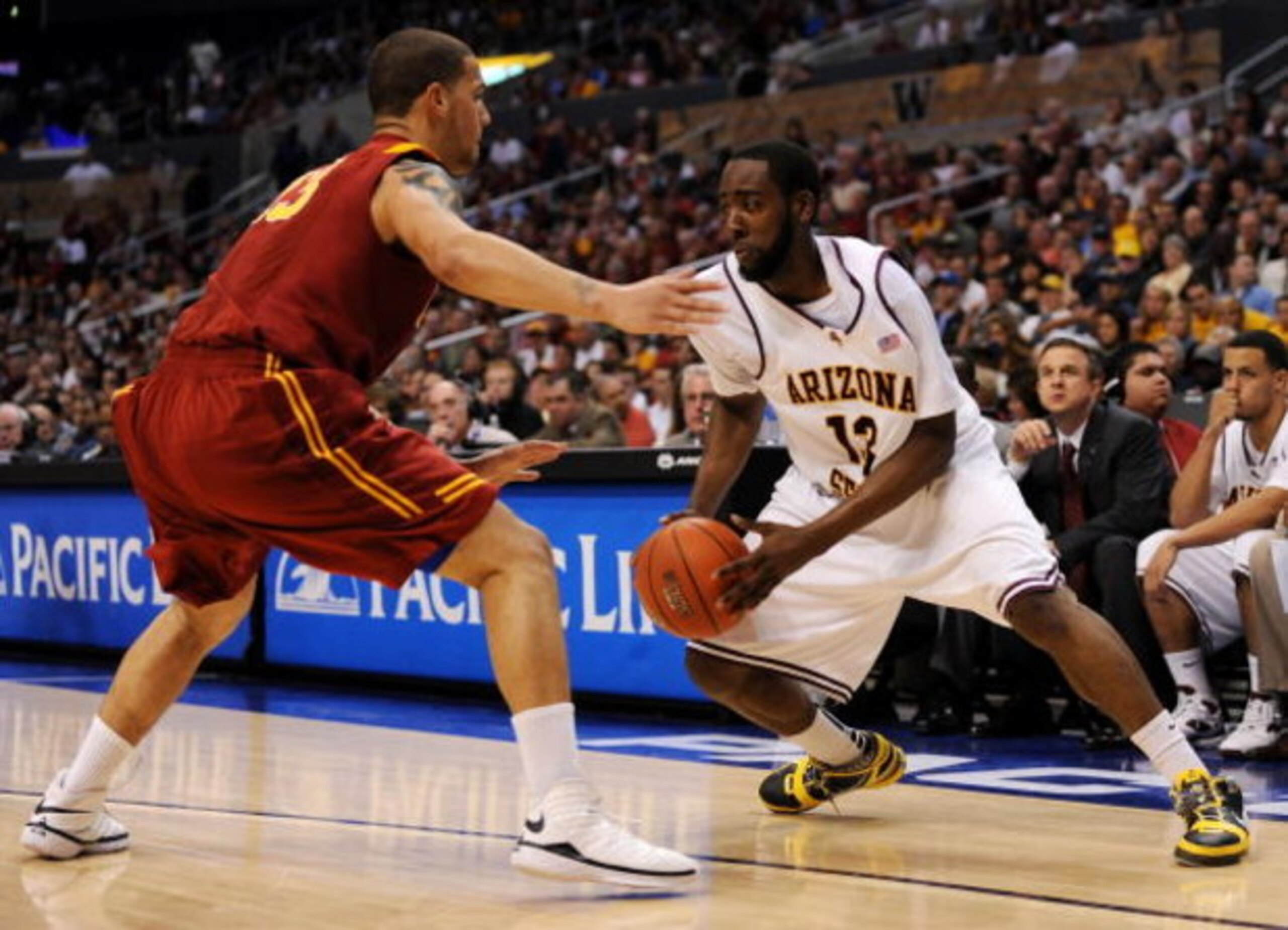 LOS ANGELES, CA - MARCH 14:  Guard James Harden #13 of the Arizona State Sun Devils drives against guard Daniel Hackett #13 of the USC Trojans in the Pacific Life Pac-10 Men's Basketball Tournament Championship Game at the Staples Center on March 14, 2009