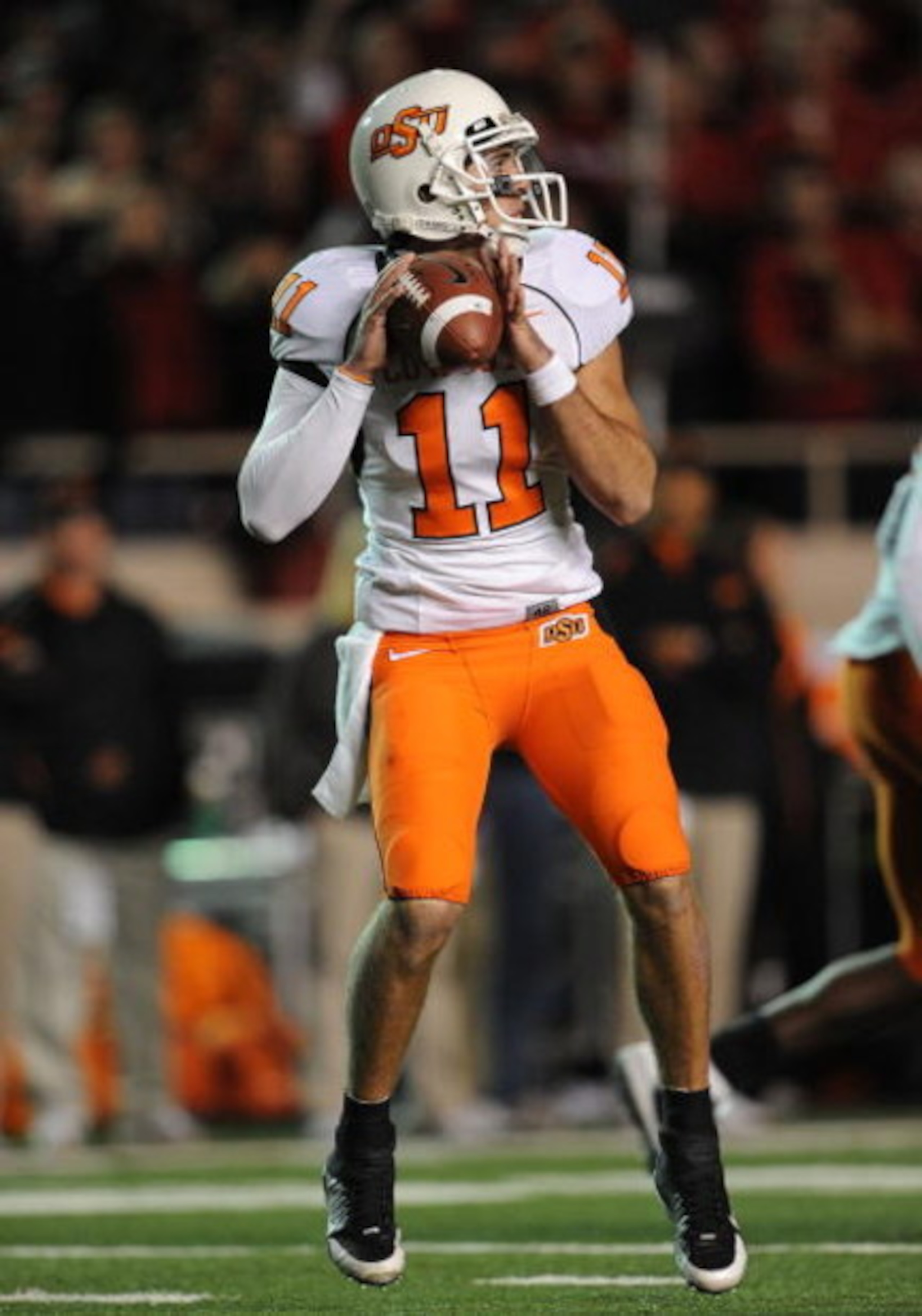 LUBBOCK, TX - NOVEMBER 08:  Quarterback Zac Robinson #11 of the Oklahoma State Cowboys during play against the Texas Tech Red Raiders at Jones AT&T Stadium on November 8, 2008 in Lubbock, Texas.  (Photo by Ronald Martinez/Getty Images)