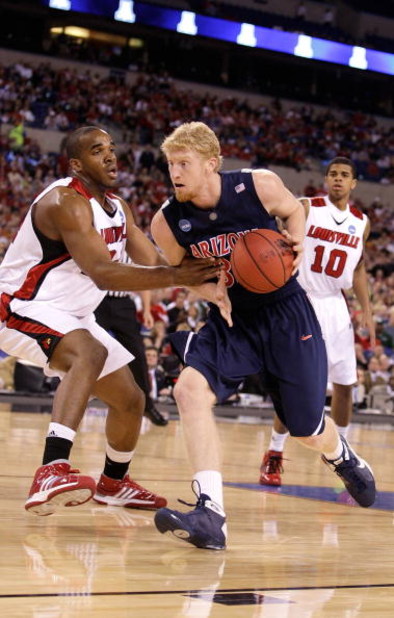 INDIANAPOLIS - MARCH 27:  Chase Budinger #34 of the Arizona Wildcats drives against the Louisville Cardinals  during the third round of the NCAA Division I Men's Basketball Tournament at the Lucas Oil Stadium on March 27, 2009 in Indianapolis, Indiana. Lo