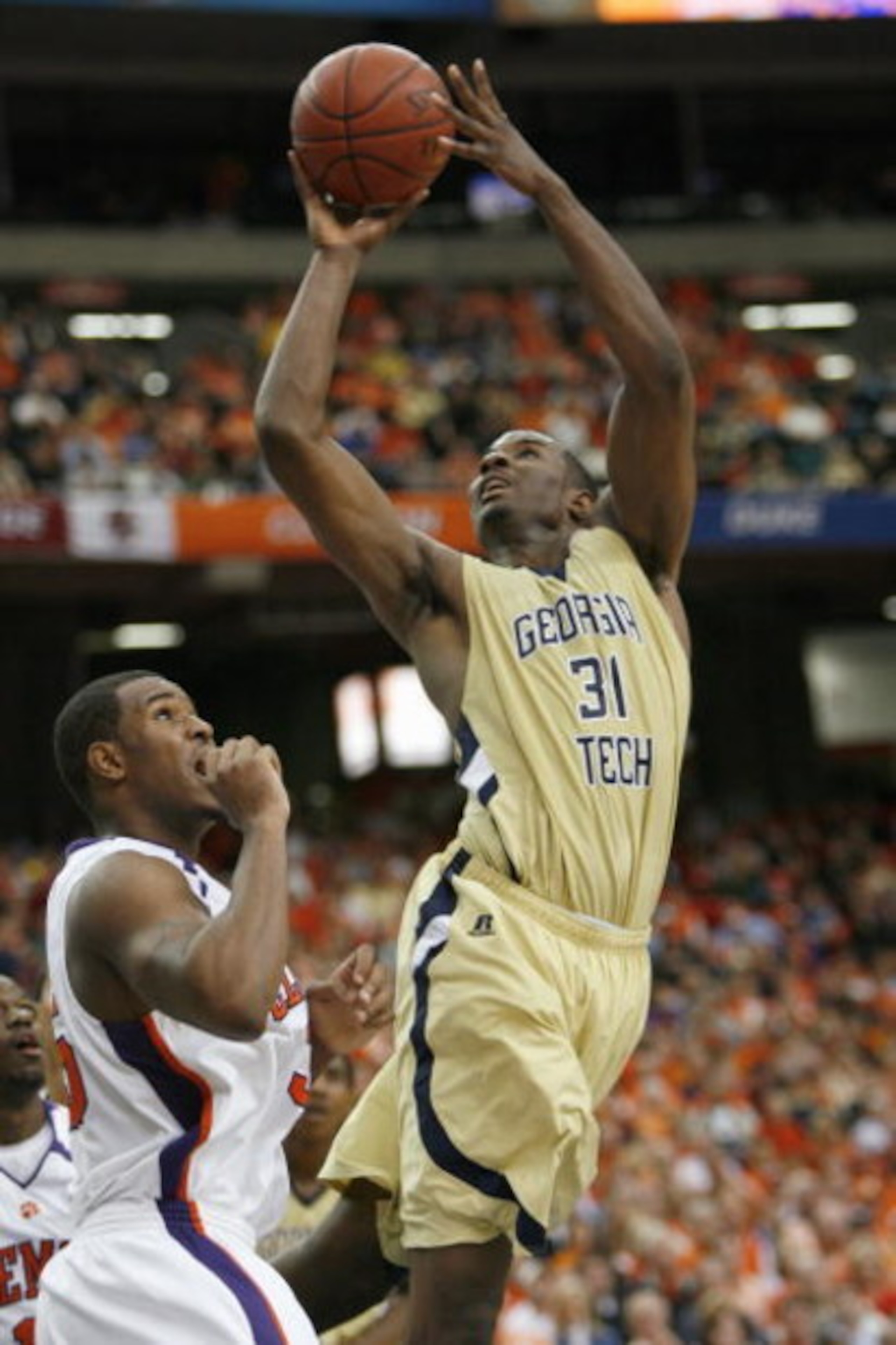 ATLANTA - MARCH 12:  Gani Lawal #31 of the Georgia Tech Yellow Jackets puts a shot up against the Clemson Tigers during day one of the 2009 ACC Men's Basketball Tournament on March 12, 2009 at the Georgia Dome in Atlanta, Georgia.  (Photo by Kevin C. Cox/