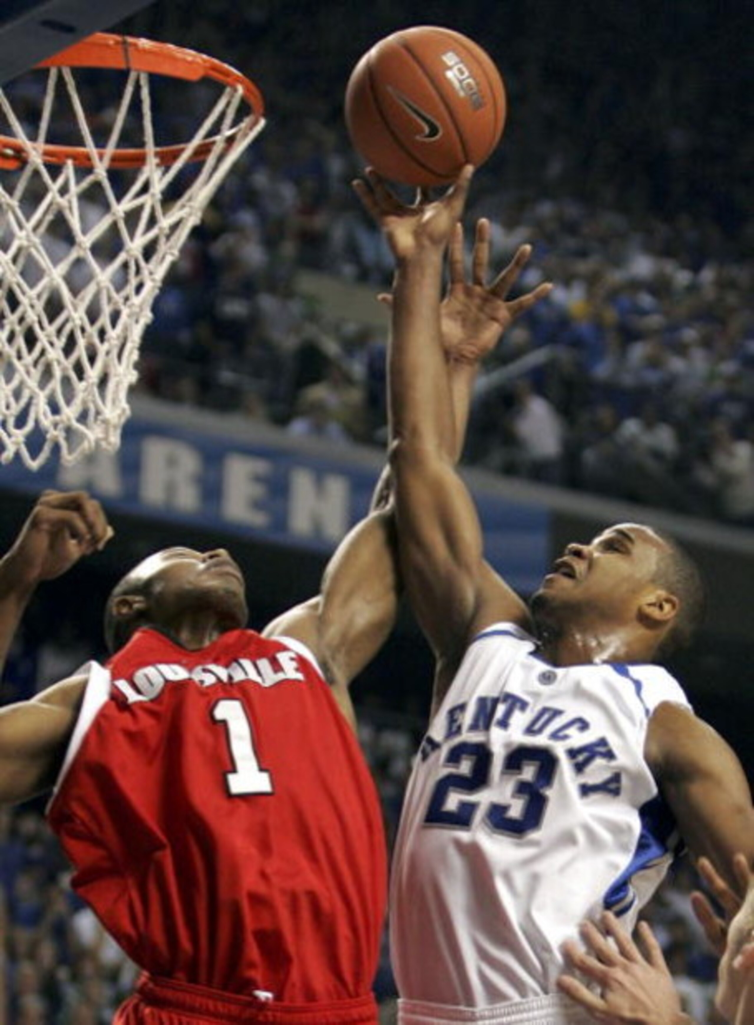 LEXINGTON, KY - DECEMBER 17:  Sheray Thomas #23 of the Kentucky Wildcats shoots the ball while defended by Terrance Williams #1 of the Louisville Cardinals during the game at Rupp Arena on December 17, 2005 in Lexington, Kentucky. Kentucky upset the 4th r