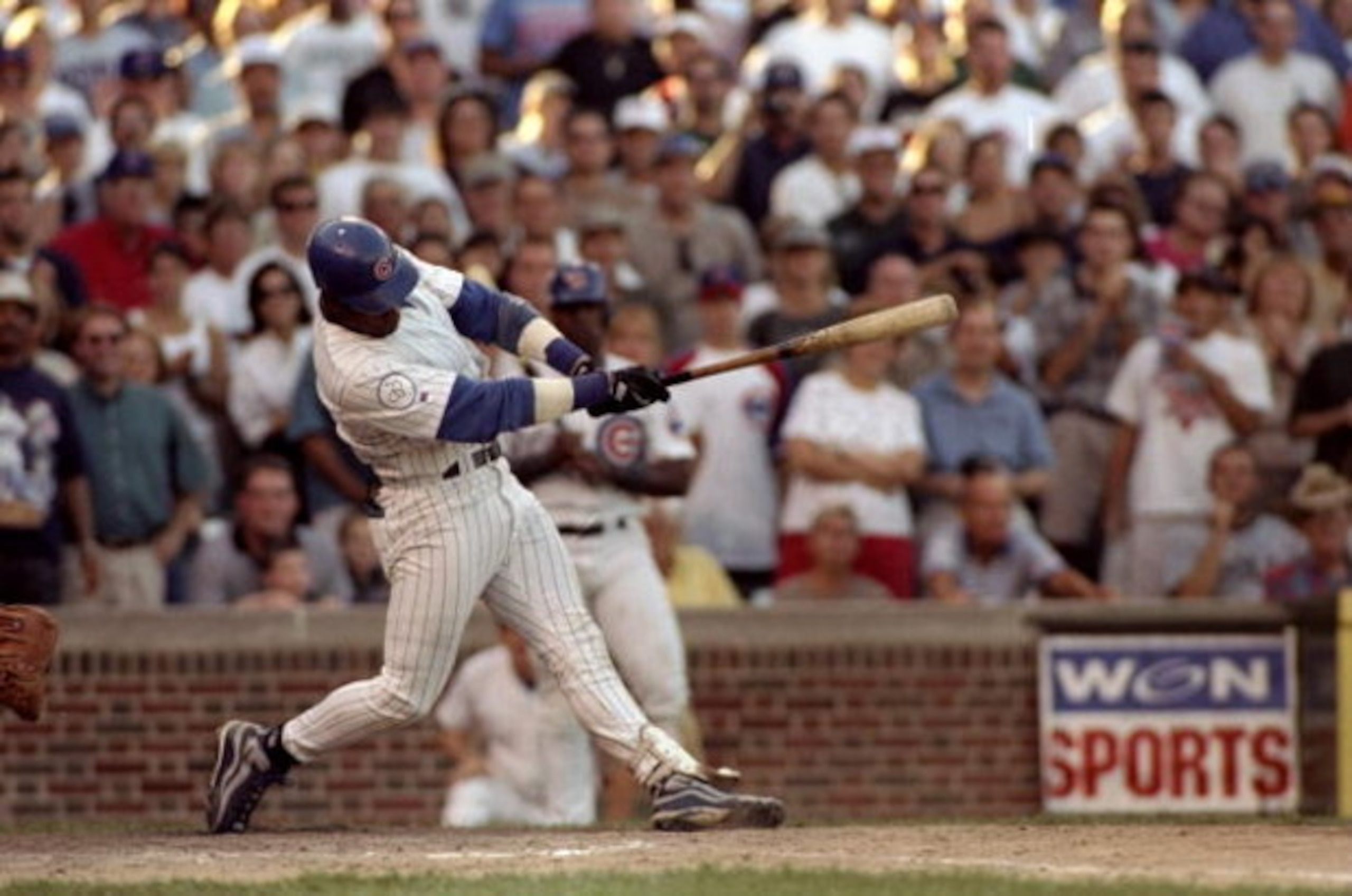 12 Sep 1998:  Sammy Sosa #21 of the Chicago Cubs hits his 60th home run during the game against the Milwaukee Brewers at Wrigley Field in Chicago, Illinois. The Cubs defeated the Brewers 15-12. Mandatory Credit: Tim Brokema  /Allsport