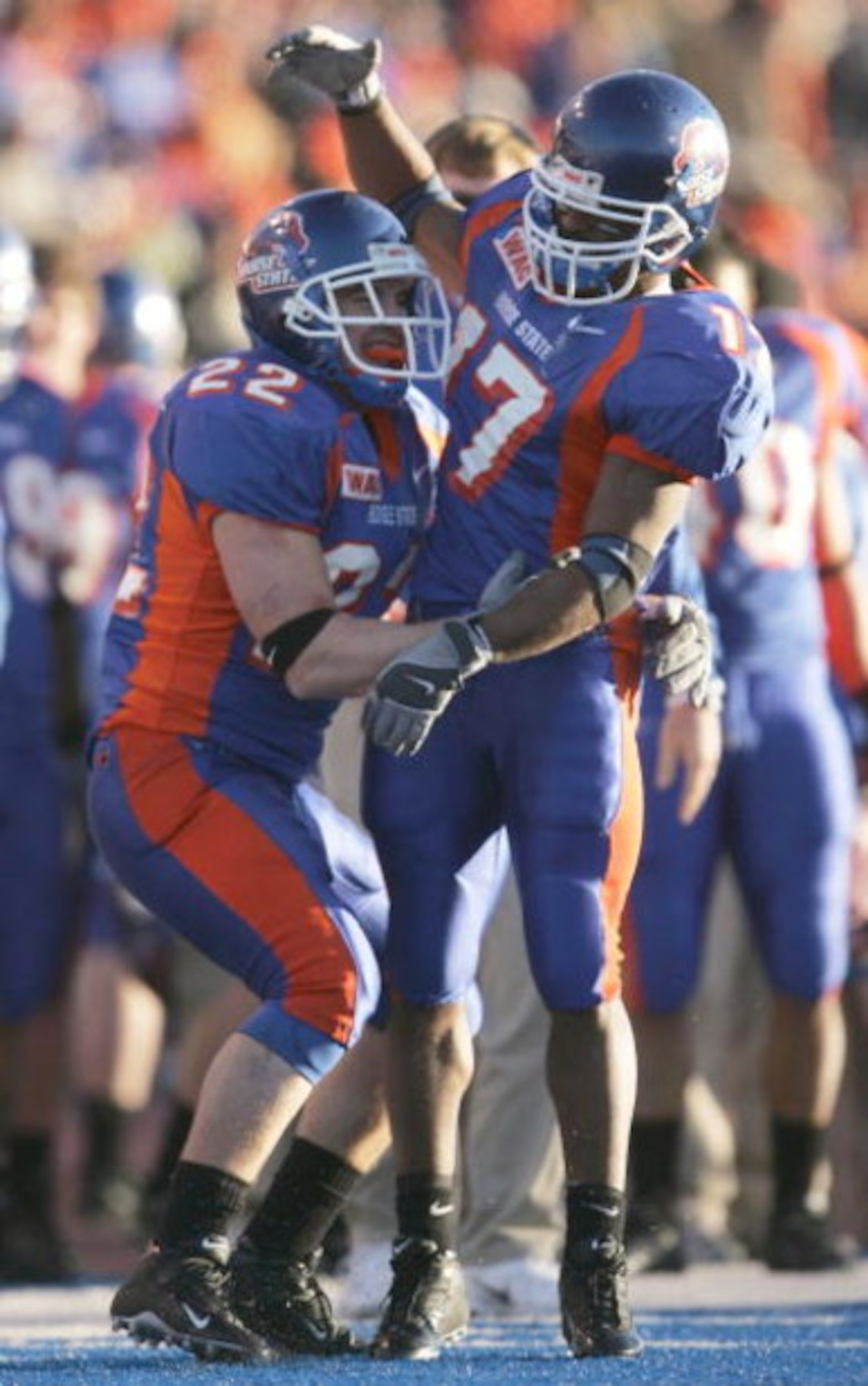 BOISE, ID - NOVEMBER 20:  Running backs Jeff Carpenter #22 and Lee Marks #17 of Boise State celebrate after Carpenter's touchdown in the fourth quarter against Louisiana Tech at Bronco Stadium on November 20, 2004 in Boise, Idaho. Boise State defeated Lou