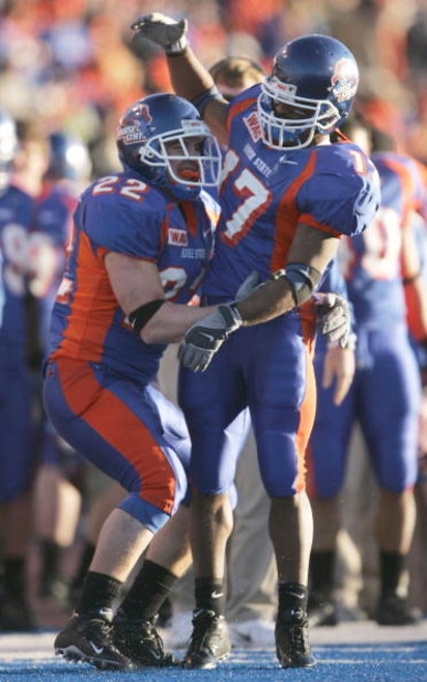 BOISE, ID - NOVEMBER 20:  Running backs Jeff Carpenter #22 and Lee Marks #17 of Boise State celebrate after Carpenter's touchdown in the fourth quarter against Louisiana Tech at Bronco Stadium on November 20, 2004 in Boise, Idaho. Boise State defeated Lou