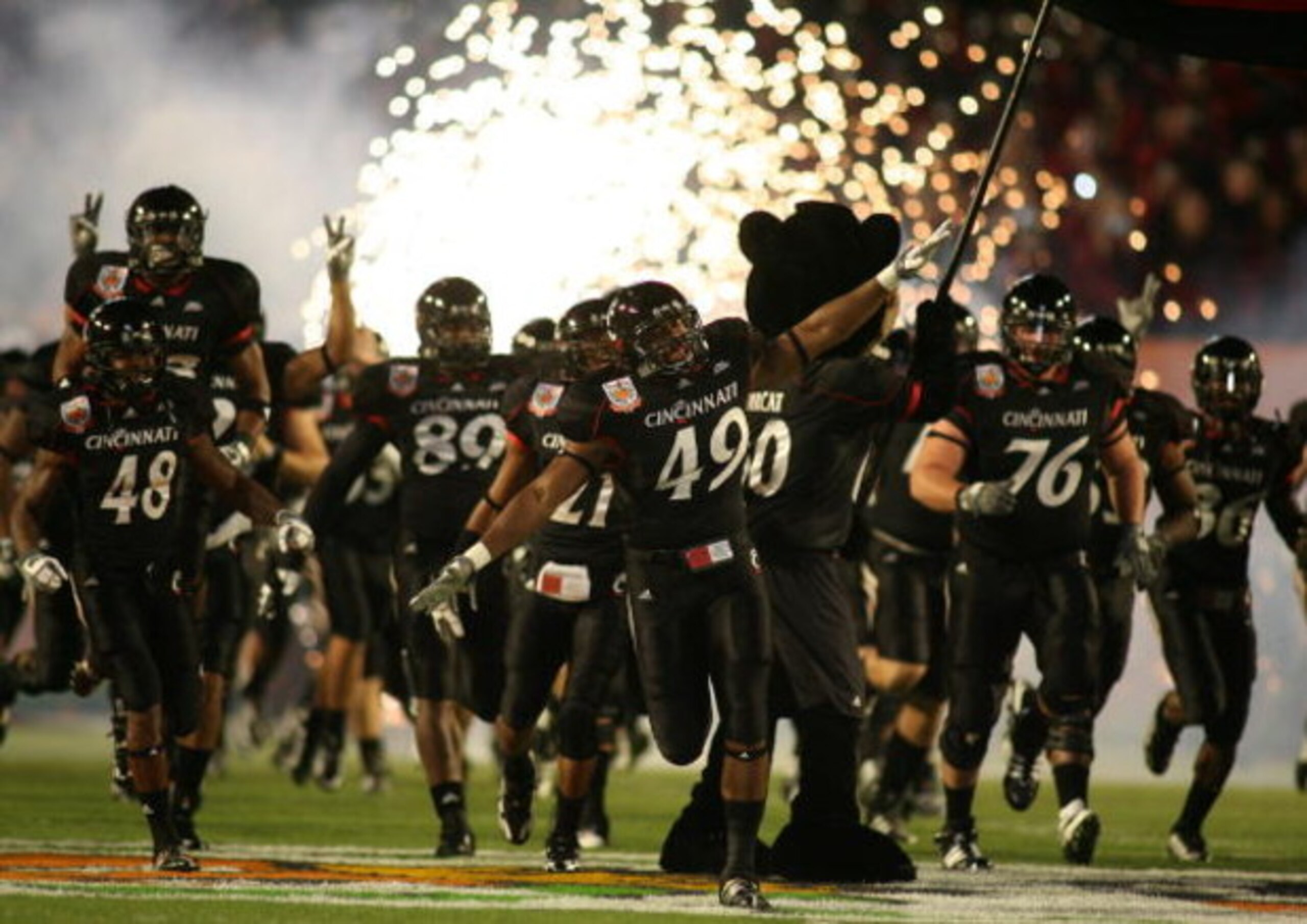 MIAMI - JANUARY 01: The Cincinnati Bearcats take the field prior start the FedEx Orange Bowl against the  Virginia Tech Hokies at Dolphin Stadium on January 1, 2009 in Miami, Florida.  (Photo by Marc Serota/Getty Images)