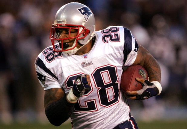 SAN DIEGO - JANUARY 14:  Runningback Corey Dillon #28 of the New England Patriots carries the ball against the San Diego Chargers during the AFC Divisional Playoff Game held at Qualcomm Stadium January 14, 2007 in San Diego, California. The Patriots defea