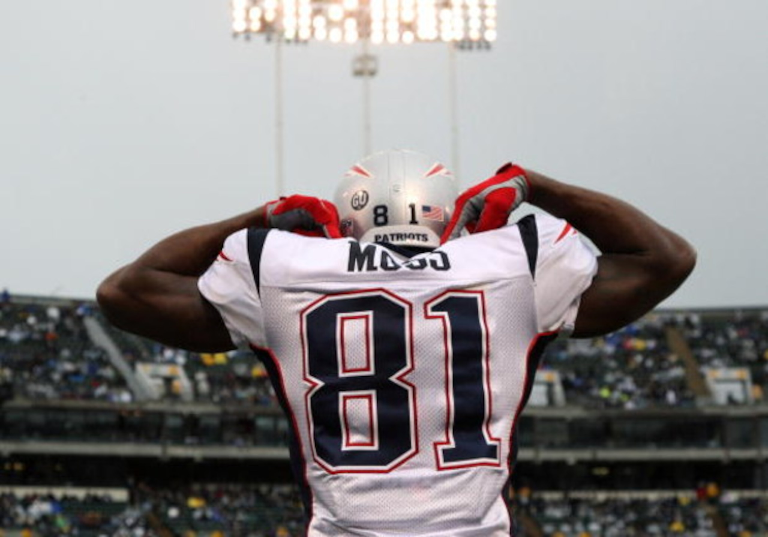 OAKLAND, CA - DECEMBER 14: Randy Moss #81 of the New England Patriots celeberates after scoring a touchdown against the Oakland Raiders during an NFL game on December 14, 2008 at the Oakland-Alameda County Coliseum in Oakland, California.  (Photo by Jed J