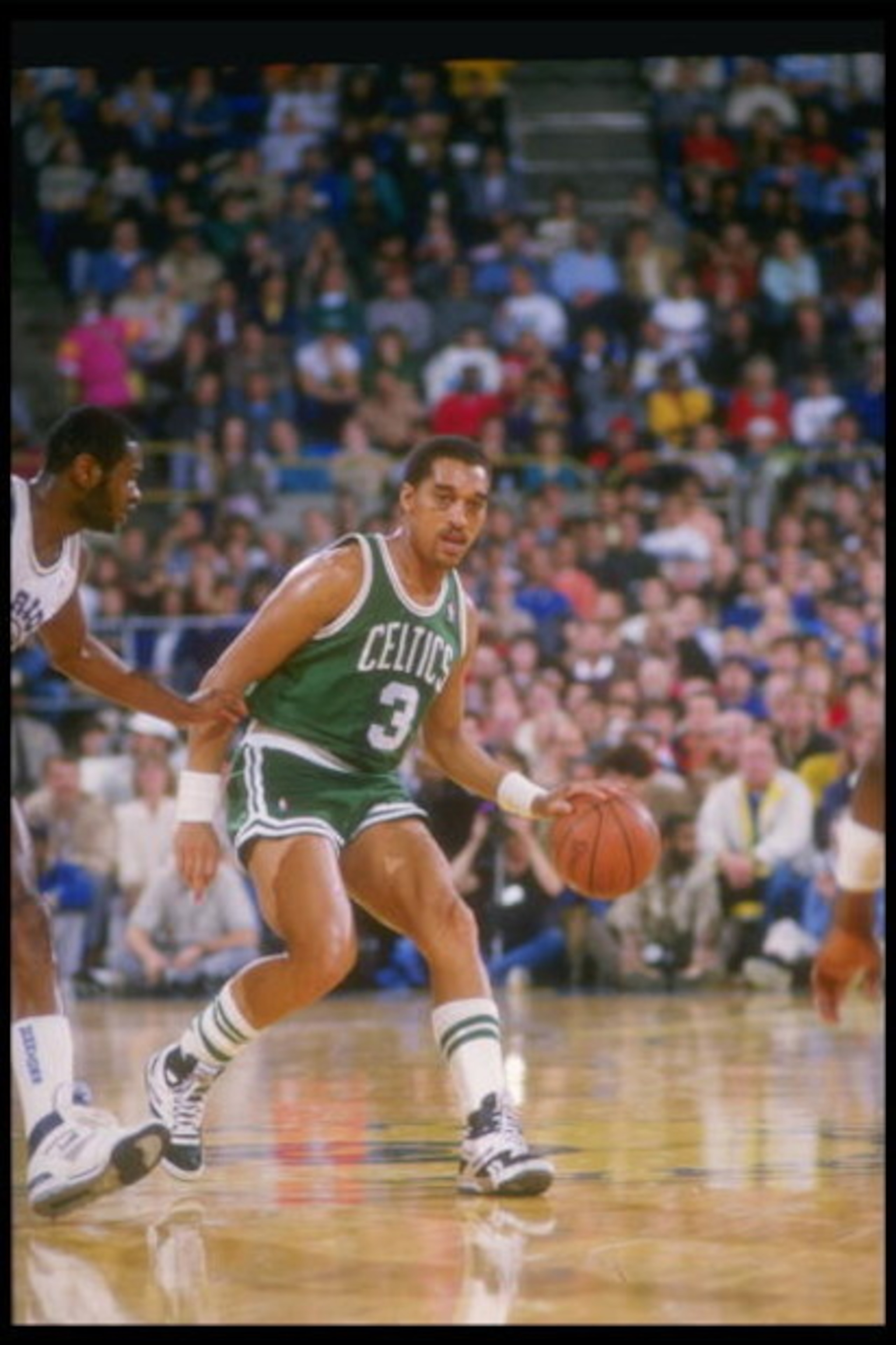 1987:  Guard Dennis Johnson of the Boston Celtics moves the ball during a game against the Golden State Warriors at the Coliseum Arena in Oakland, California. Mandatory Credit: Otto Greule Jr.  /Allsport