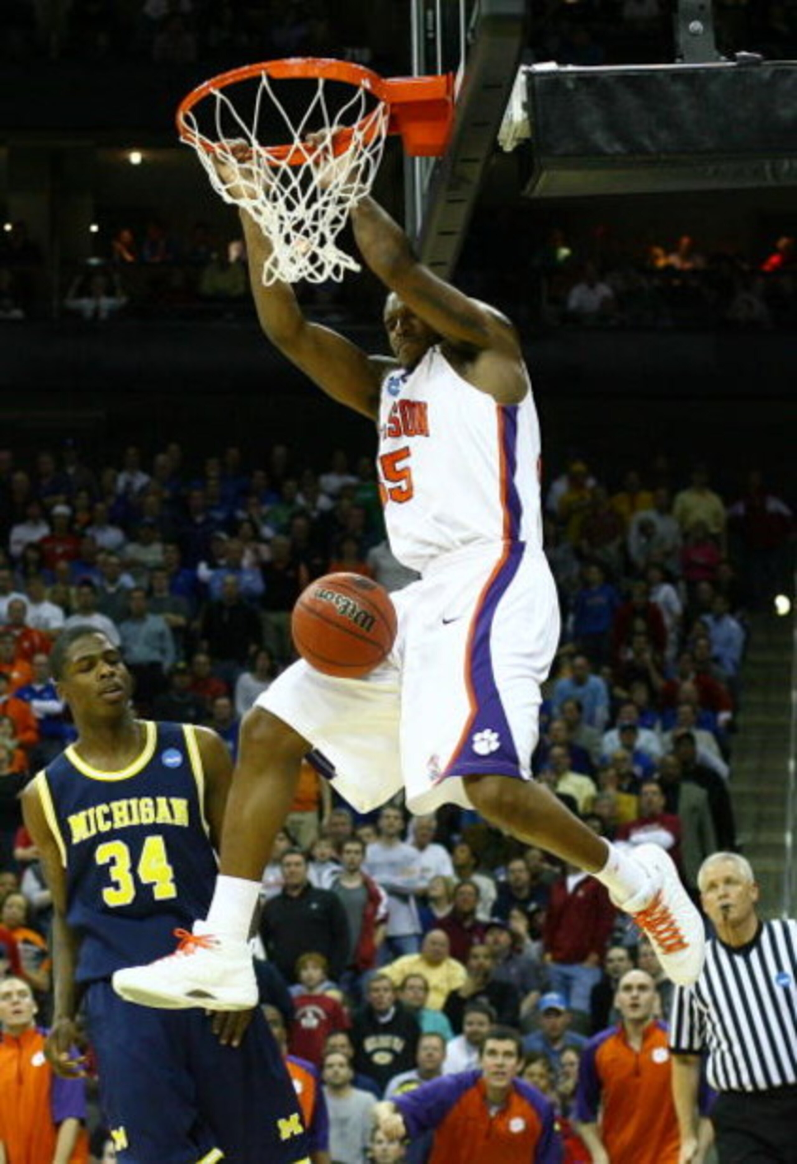 KANSAS CITY, MO - MARCH 19:  Trevor Booker #35 of the Clemson Tigers dunks the ball in the second half as DeShawn Sims #34 of the Michigan Wolverines looks on in the second half during the first round of the NCAA Division I Men's Basketball Tournament at 