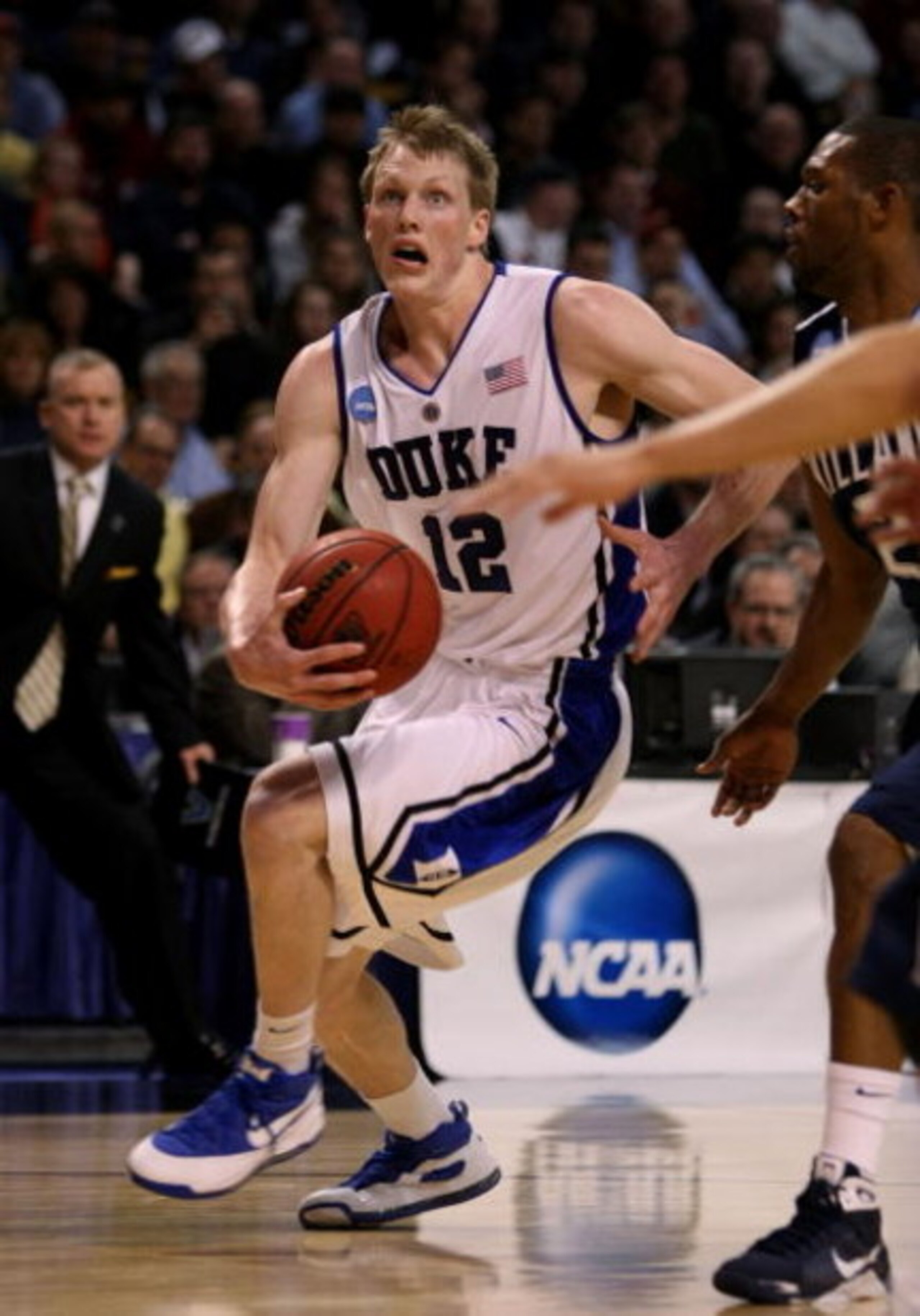 BOSTON - MARCH 26:  Kyle Singler #12 of the Duke Blue Devils drives against the Villanova Wildcats during the NCAA Men's Basketball Tournament East Regionals at TD Banknorth Garden on March 26, 2009 in Boston, Massachusetts.  (Photo by Elsa/Getty Images)