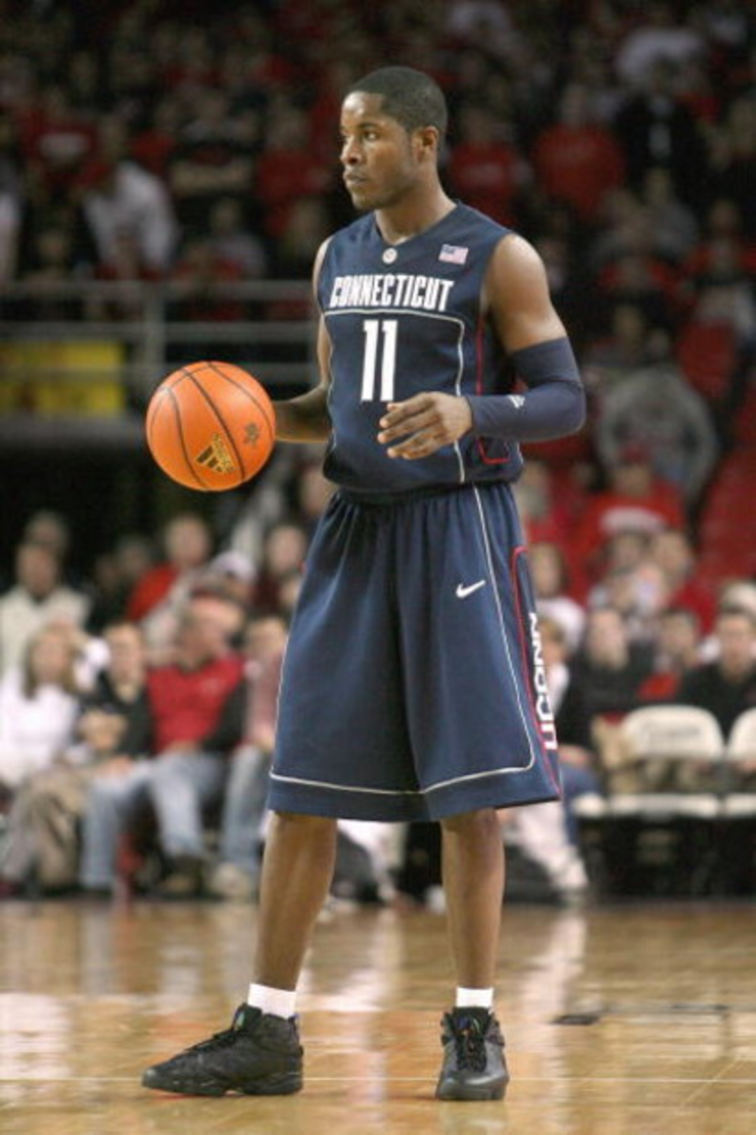 LOUISVILLE, KY - FEBRUARY 2: Jerome Dyson #11 of the Connecticut Huskies dribbles the ball during the Big East Conference game against the Louisville Cardinals on February 2, 2009 at Freedom Hall in Louisville, Kentucky.  (Photo by Andy Lyons/Getty Images