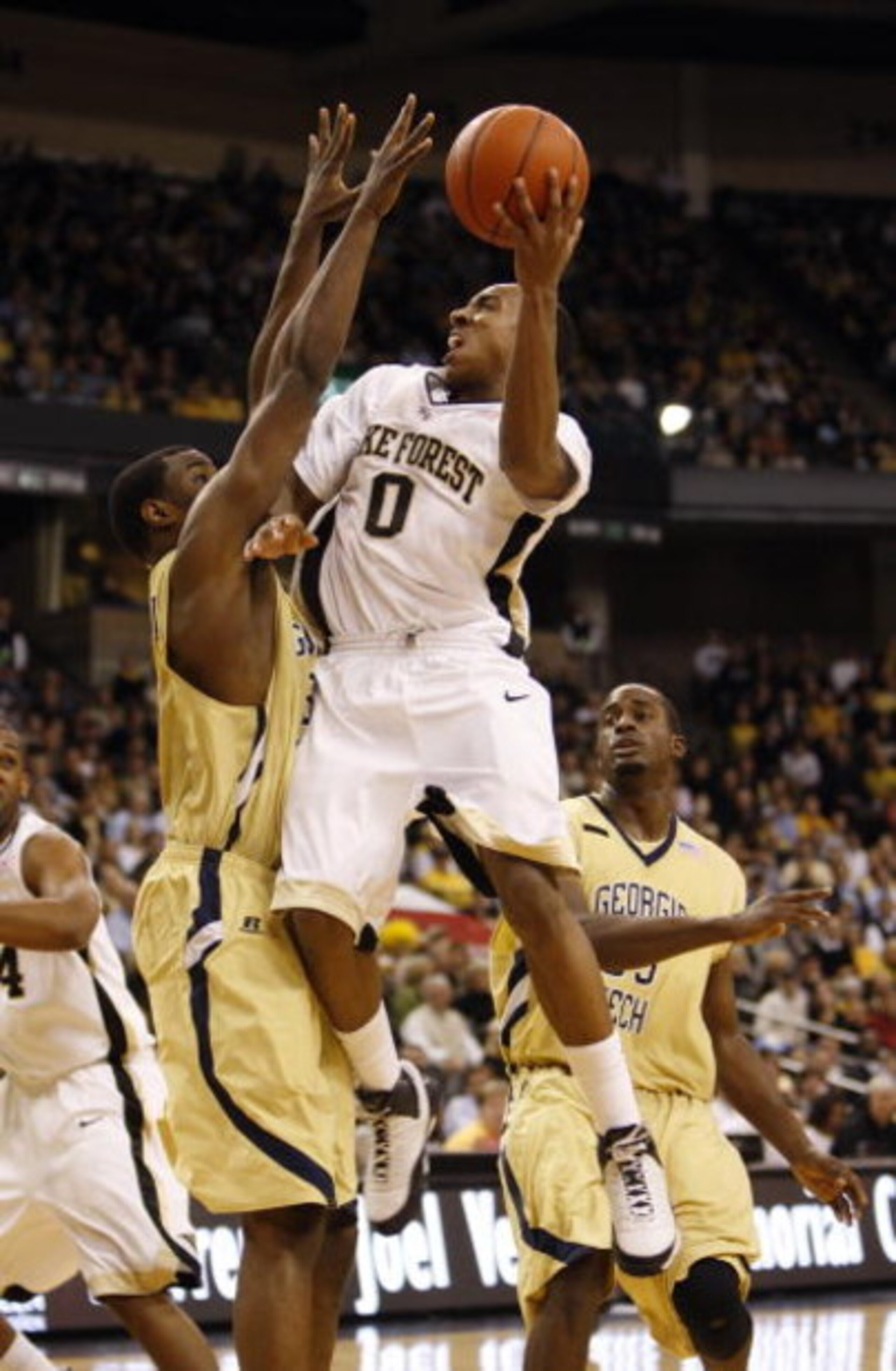 WINSTON-SALEM, NC - FEBRUARY 18:  Jeff Teague #0 of the Wake Forest Demon Deacons jumps to the basket for a lay up during their game against the Georgia Tech Yellow Jackets at Lawrence Joel Coliseum on February 18, 2009 in Winston-Salem, North Carolina. T