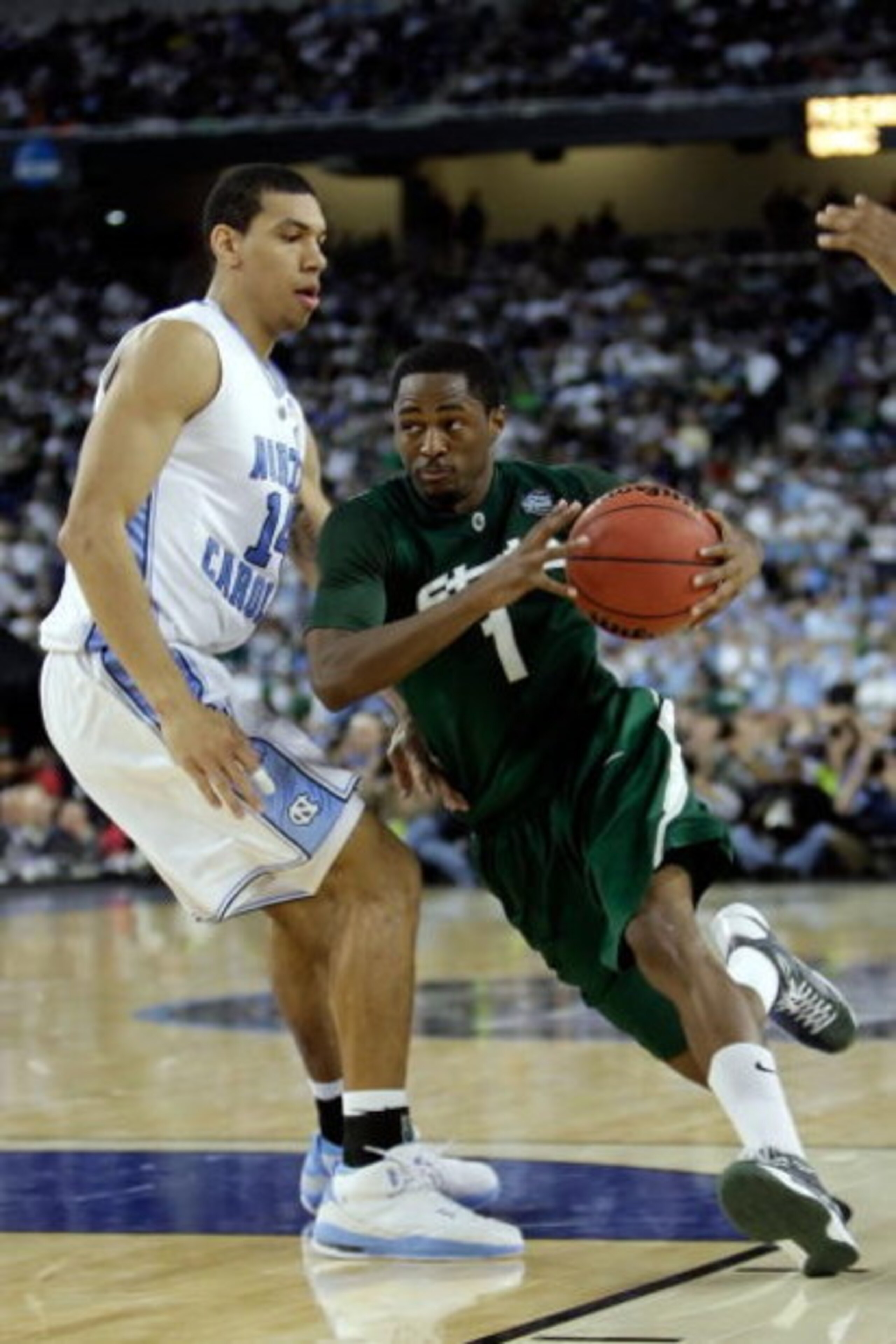 DETROIT - APRIL 06:  Kalin Lucas #1 of the Michigan State Spartans drives on Danny Green #14 of the North Carolina Tar Heels during the 2009 NCAA Division I Men's Basketball National Championship game at Ford Field on April 6, 2009 in Detroit, Michigan.  