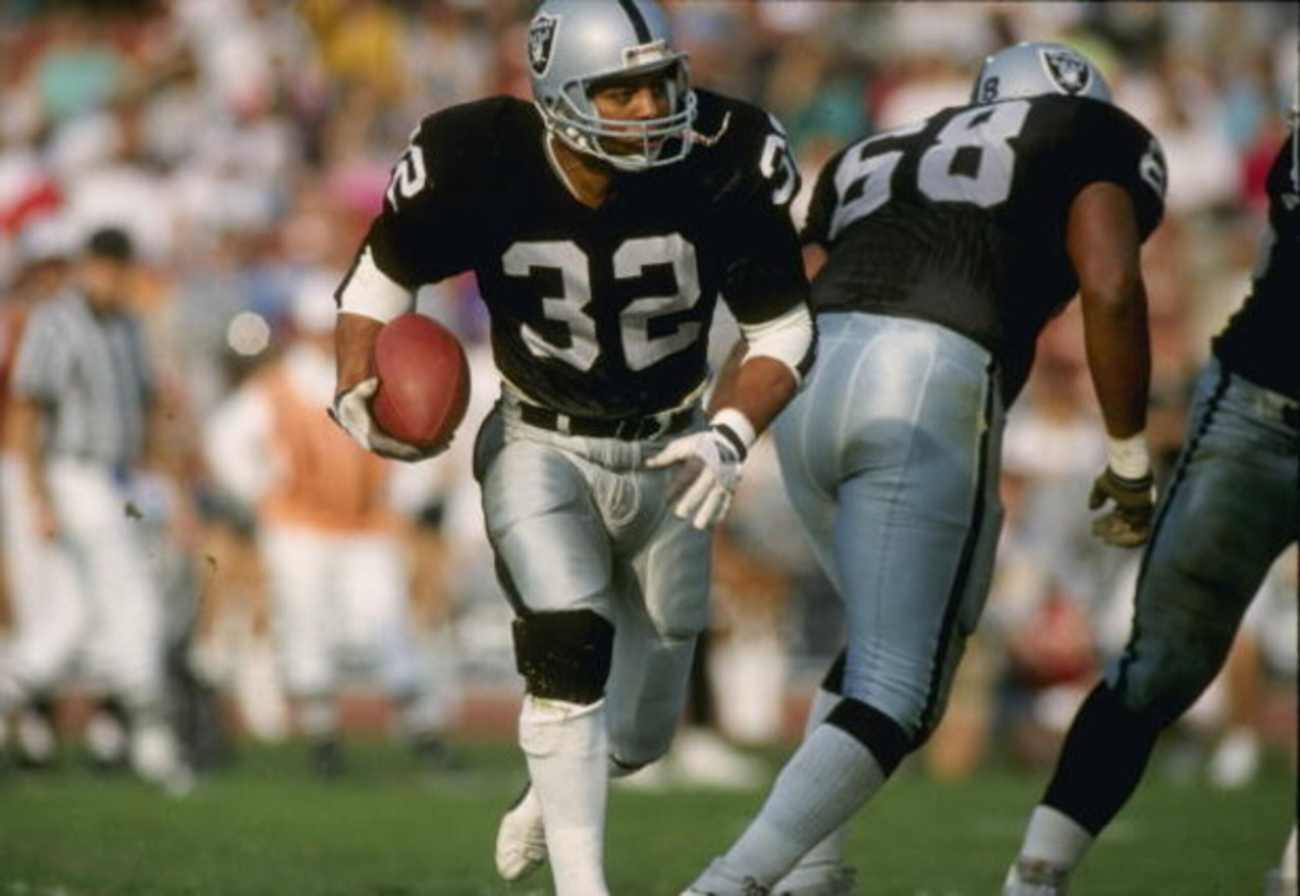 23 Mar 1997: Running back Marcus Allen of the Los Angeles Raiders in action during a game against the Phoenix Cardinals at the Memorial Coliseum in Los Angeles, California. The Raiders won the game, 16-14.
