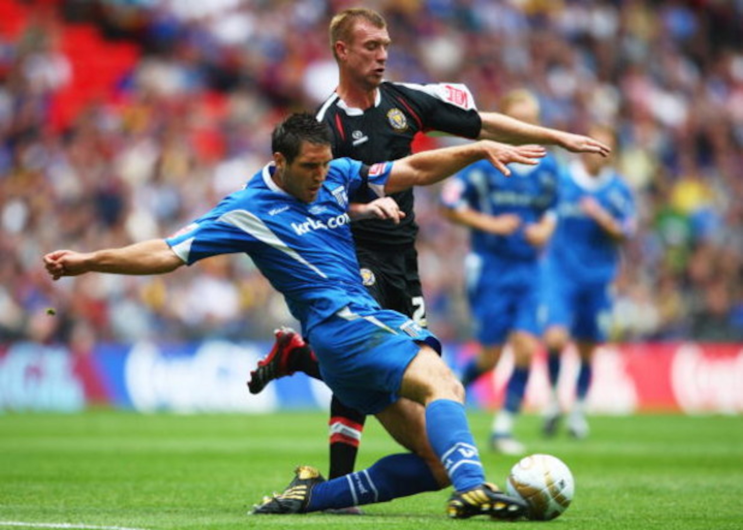 LONDON, ENGLAND - MAY 23:  Garry Richards of Gillingham tackles Nick Chadwick of Shrewsbury Town during the Coca Cola League 2 Playoff Final match between Gillingham and Shrewsbury Town at Wembley Stadium on May 23, 2009 in London, England.  (Photo by Jam