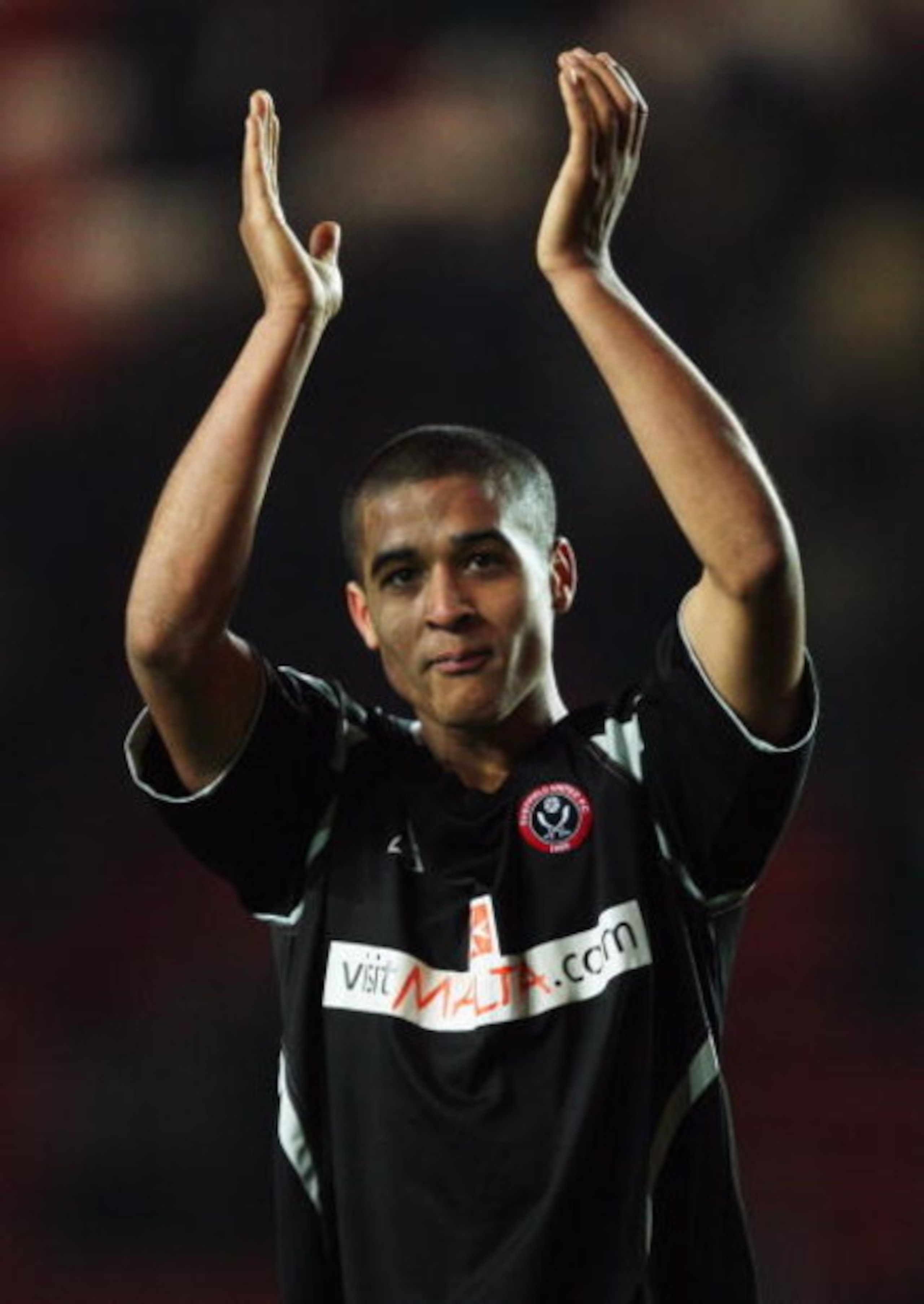 SOUTHAMPTON, UNITED KINGDOM - FEBRUARY 03: Kyle Naughton of Sheffield United acknowledges the fans after the Coca Cola Championship match between Southampton and Sheffield United at St. Mary's Stadium on February 3, 2009 in Southampton, England.  (Photo b