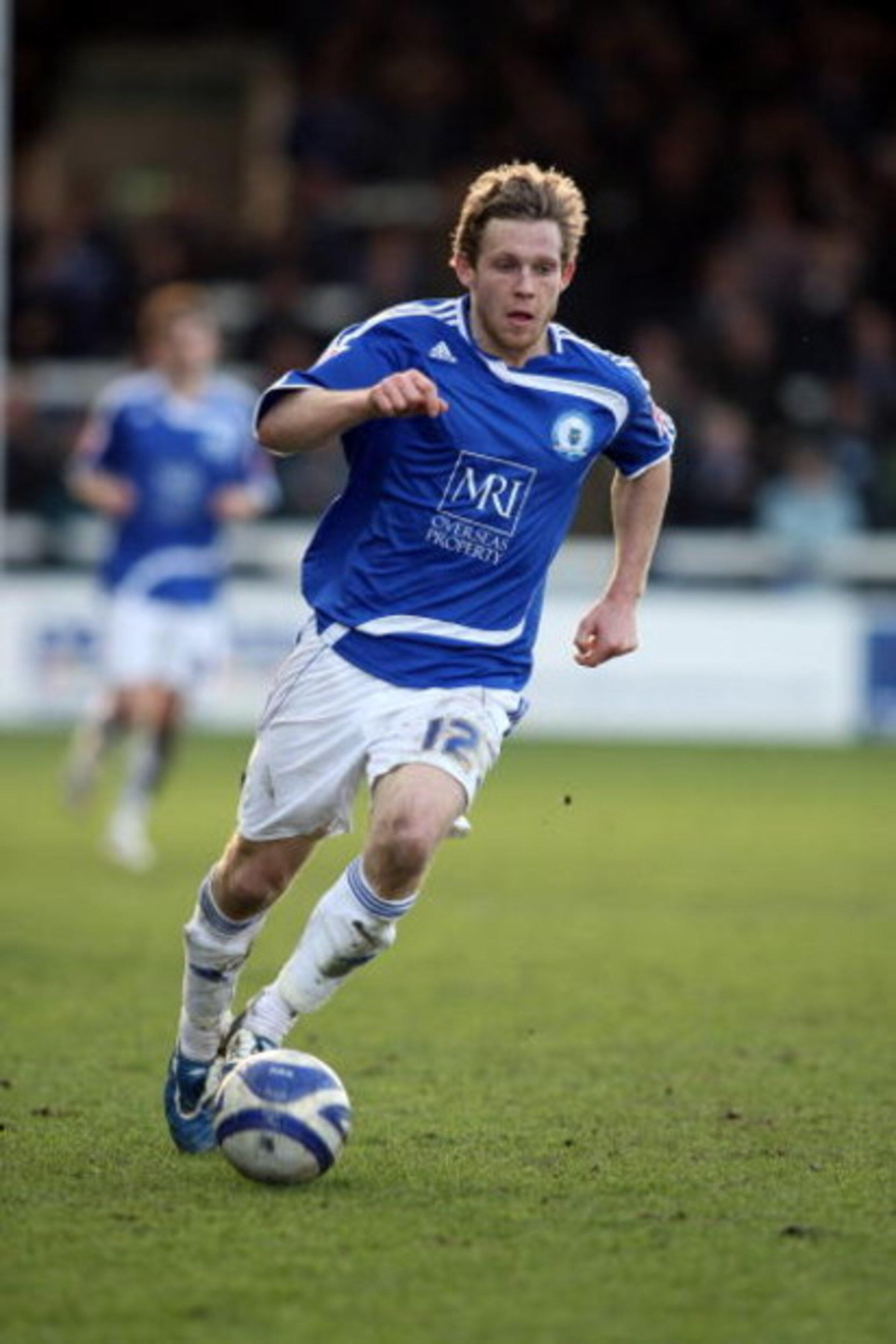 PETERBOROUGH, UNITED KINGDOM - MARCH 14:  Craig Mackail-Smith of Peterborough United runs with the ball during the Coca Cola League One Match between Peterborough United and Northampton Town at London Road on March 14, 2009 in Peterborough, England. (Phot