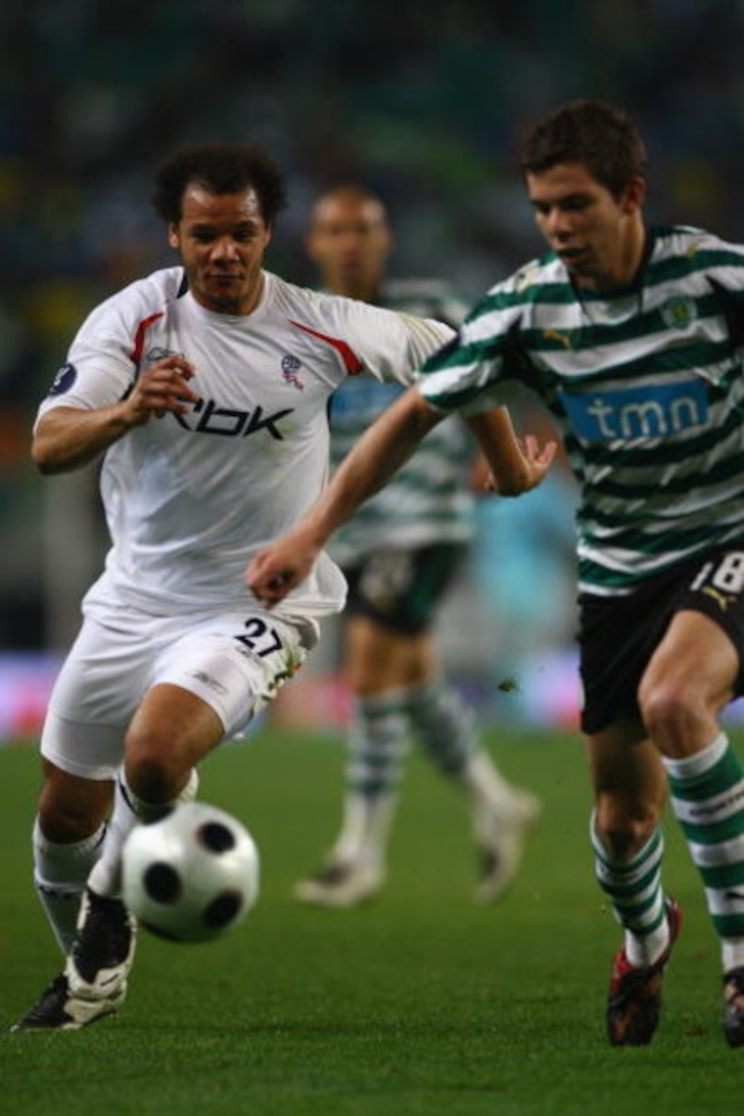 LISBON, PORTUGAL - MARCH 13:  Danny Braaten (left) of Bolton chases down Grimi during the UEFA Cup Round of 16 second leg match between Sporting Lisbon and Bolton Wanderers at the Alvalade XXI Stadium on March 13, 2008 in Lisbon, Portugal.  (Photo by Mich