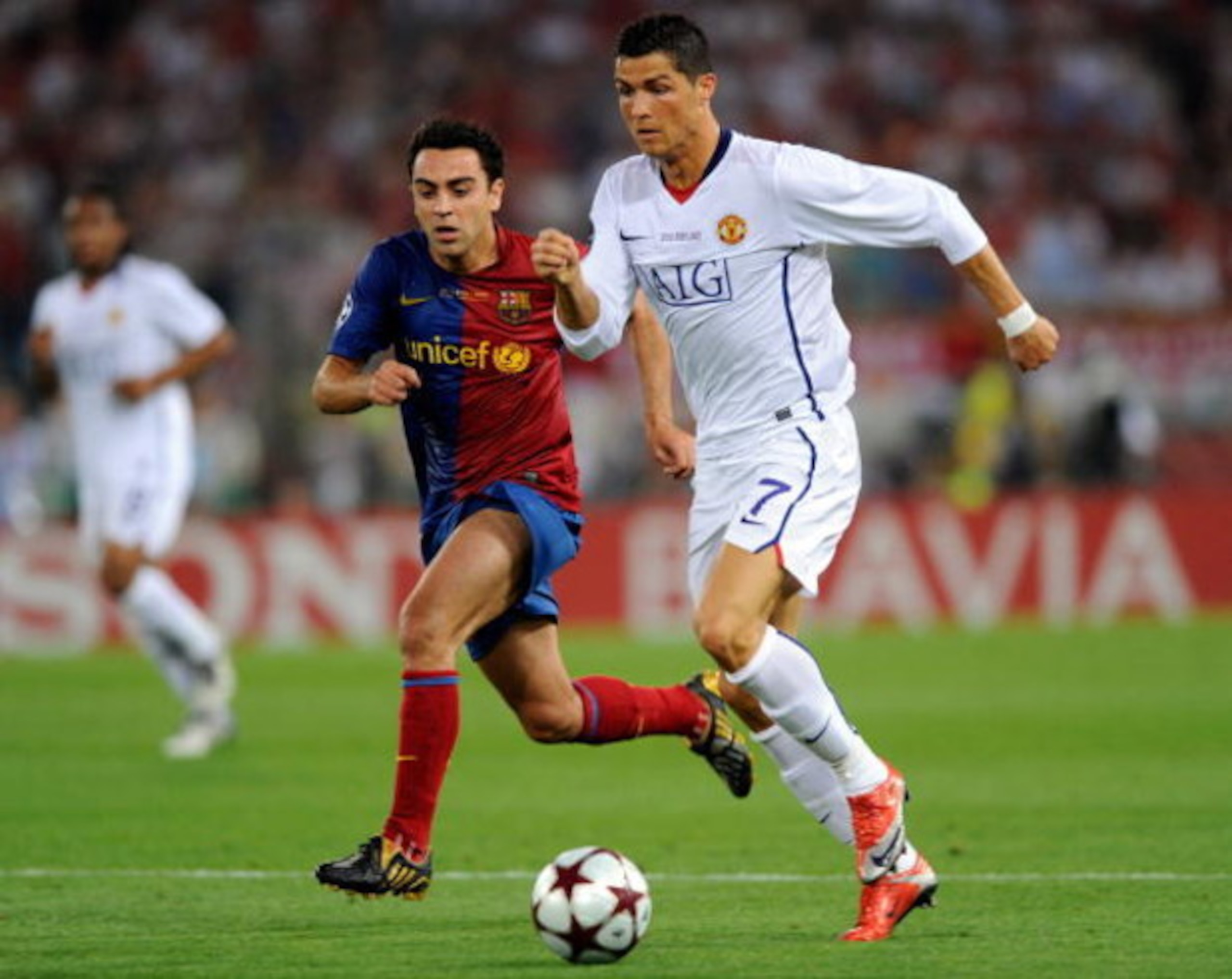 ROME, ITALY - MAY 27:  Cristiano Ronaldo (R) of Manchester United FC is tracked by Xavi Hernandez of Barcelona during the UEFA Champions League Final match between Barcelona and Manchester United at the Stadio Olimpico on May 27, 2009 in Rome, Italy.  (Ph