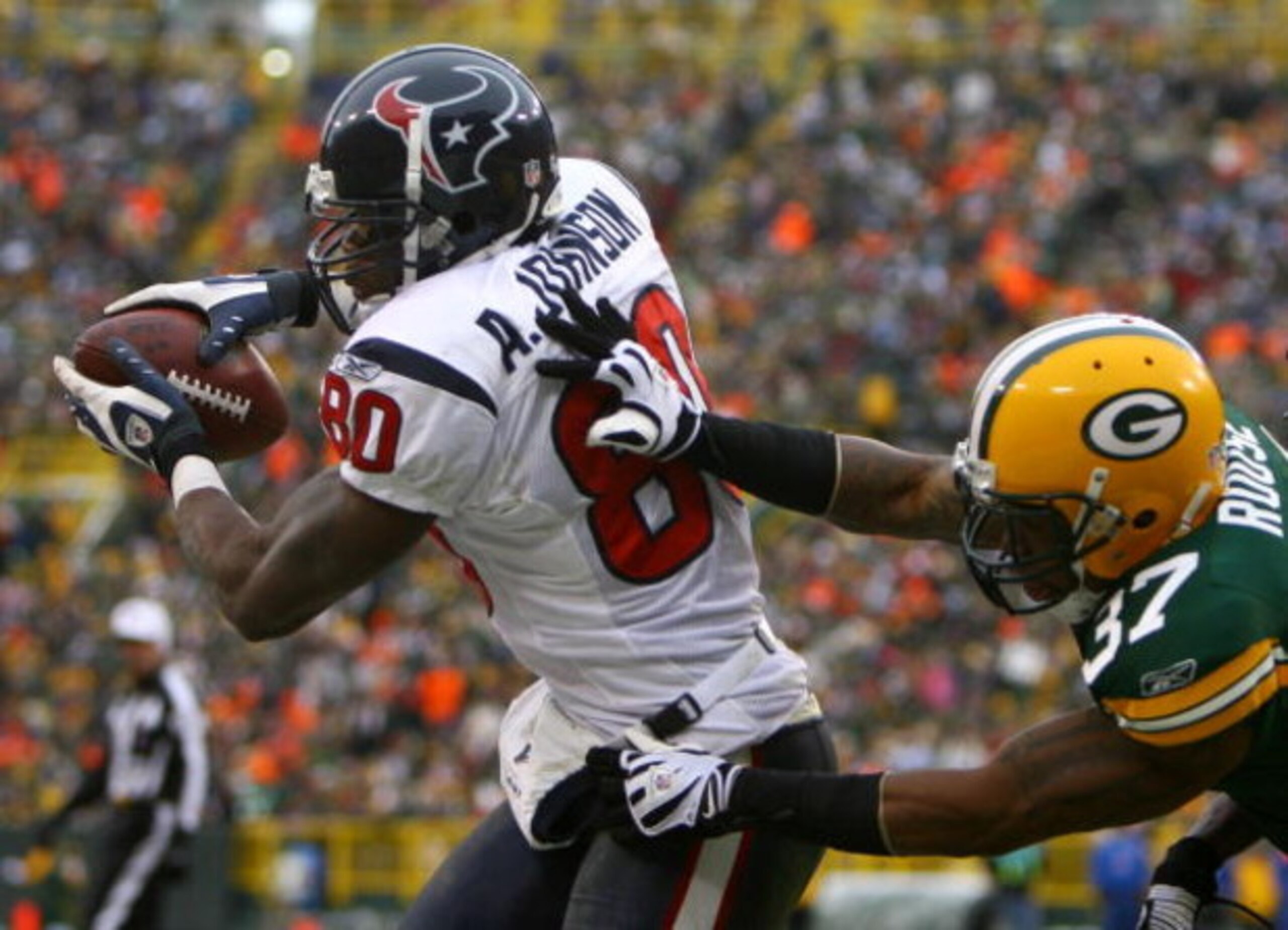 GREEN BAY, WI - DECEMBER 07:  Andre Johnson #80 of the Houston Texans catches a pass for a two-point conversion in front of Aaron Rouse #37 of the Green Bay Packers during the fourth quarter at Lambeau Field on December 7, 2008 in Green Bay, Wisconsin. Th
