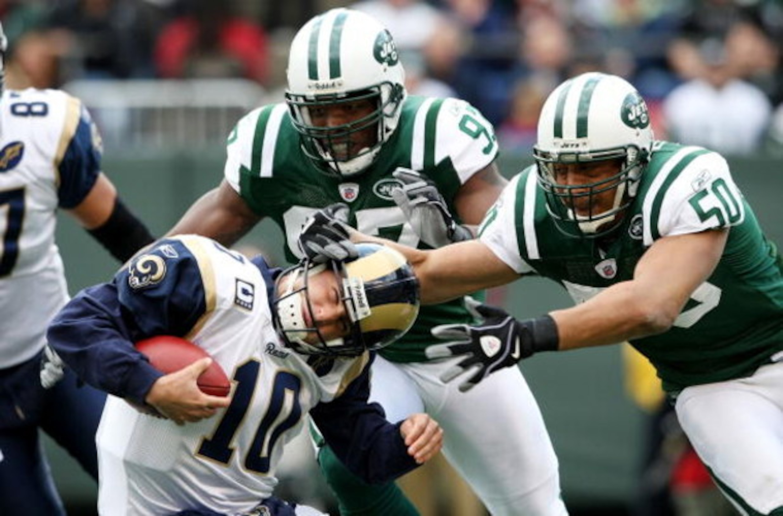 EAST RUTHERFORD, NJ - NOVEMBER 09: Calvin Pace #97 and Eric Barton #50 of the New York Jets sack Marc Bulger #10 of the St. Louis Rams at Giants Stadium on November 9, 2008 in East Rutherford, New Jersey.  (Photo by Nick Laham/Getty Images)