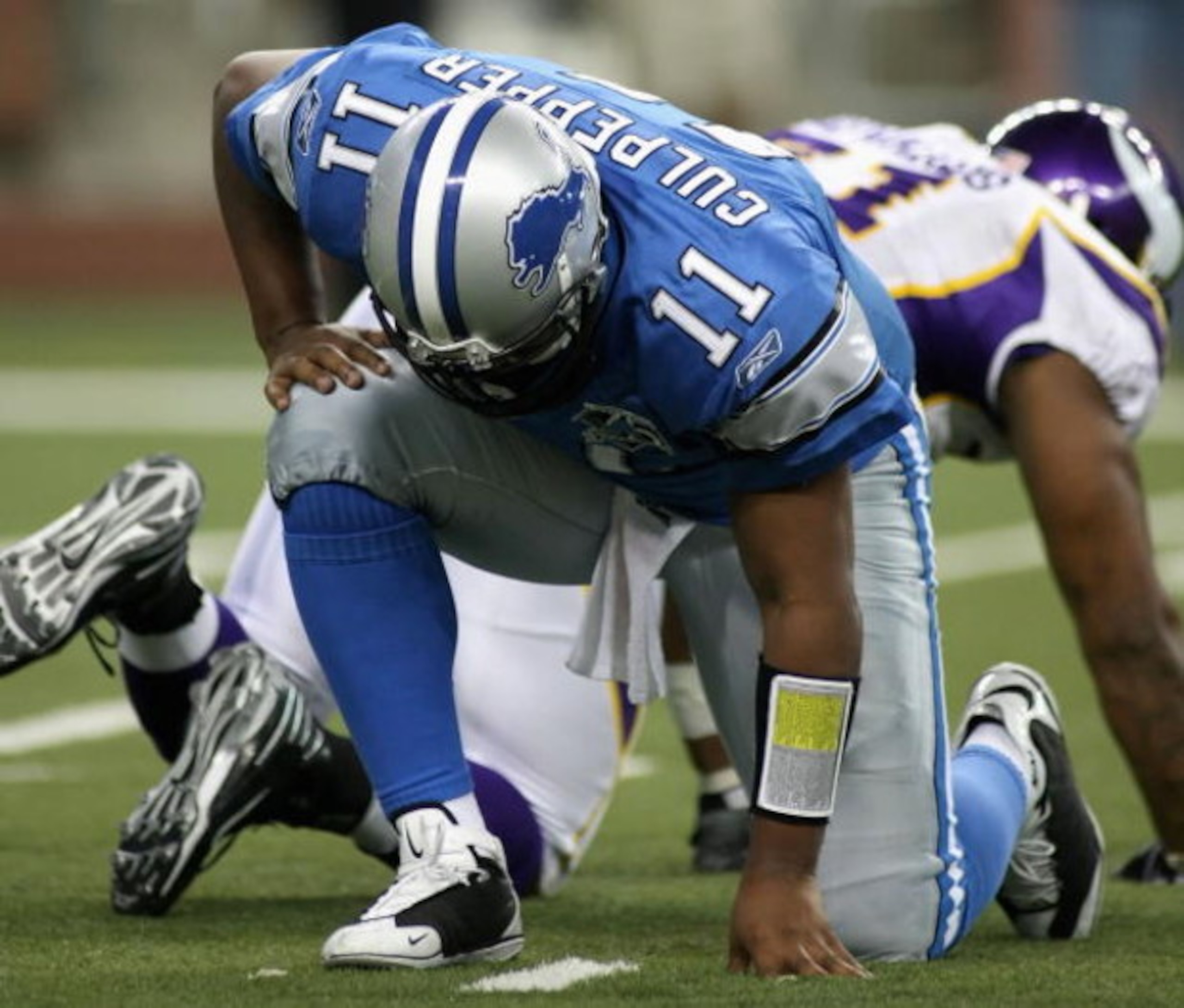 DETROIT - DECEMBER 07:  Quarterback Daunte Culpepper #11 of the Detroit Lions picks himself up against the Minnesoa Vikings during the NFL game at Ford Field on December 7, 2008 in Detroit, Michigan.  The Vikings defeated the Lions 20-16.  (Photo by Chris