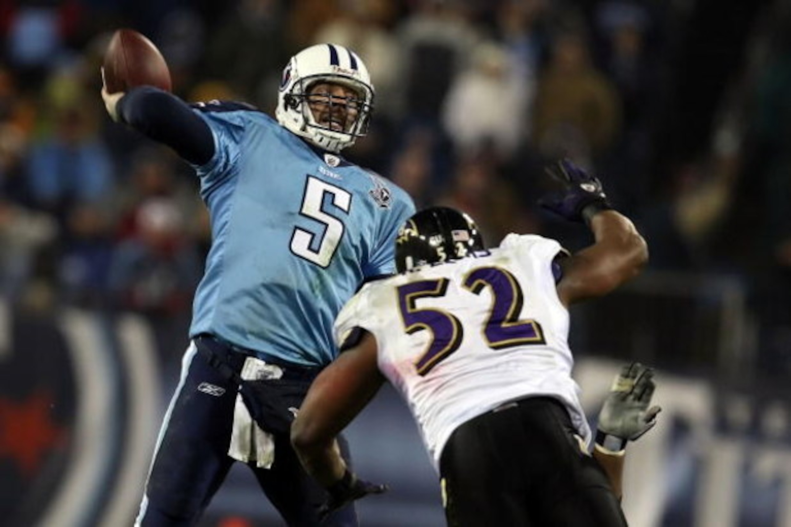 NASHVILLE, TN - JANUARY 10:  Quarterback Kerry Collins #5 of the Tennessee Titans throws the ball as linebacker Ray Lewis #52 of the Baltimore Ravens dives after him during the AFC Divisional Playoff Game on January 10, 2009 at LP Field in Nashville, Tenn