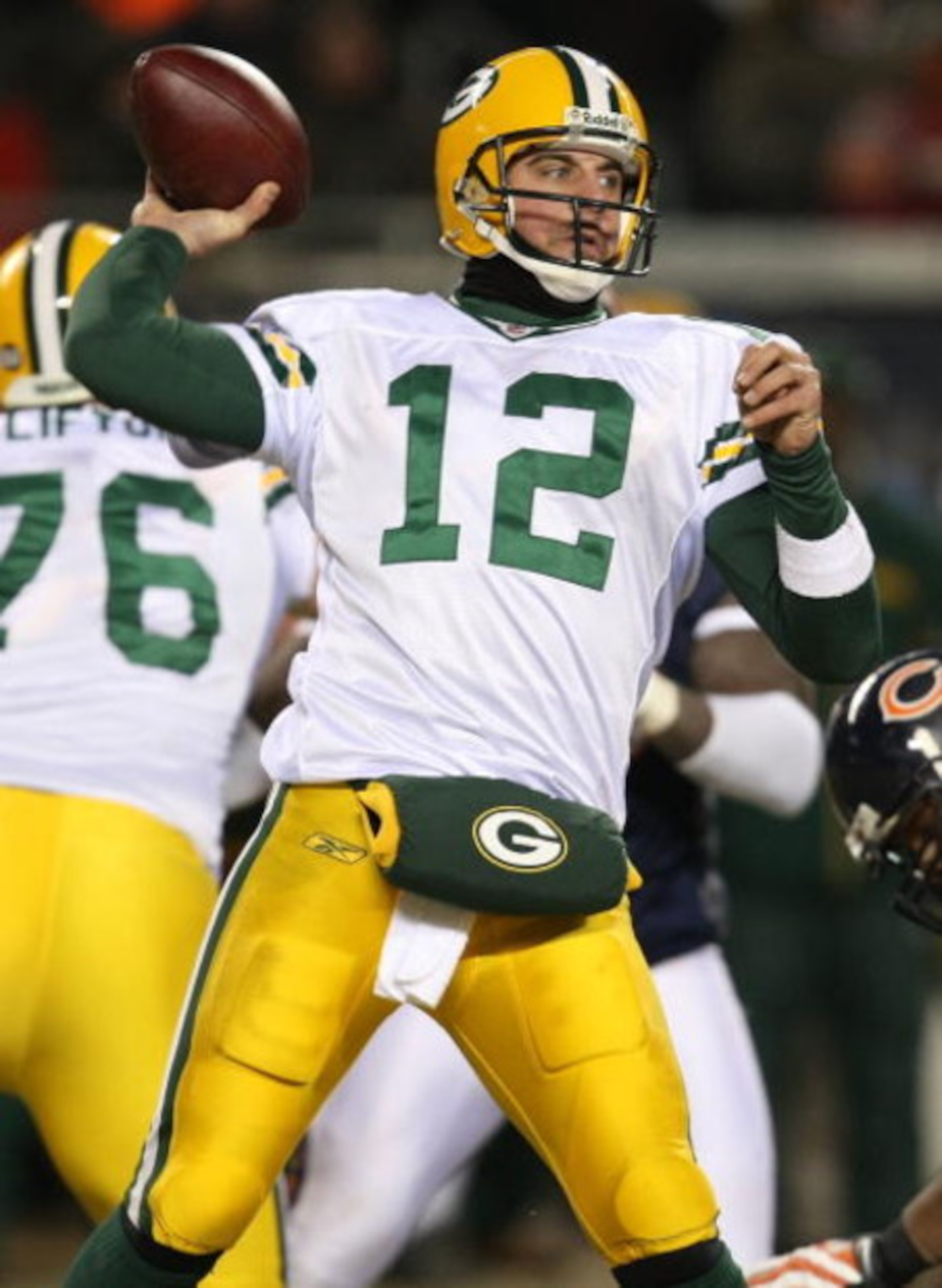 CHICAGO - DECEMBER 22: Aaron Rodgers #12 of the Green Bay Packers throws a pass against the Chicago Bears on December 22, 2008 at Soldier Field in Chicago, Illinois. The Bears defeated the Packers 20-17 in overtime. (Photo by Jonathan Daniel/Getty Images)