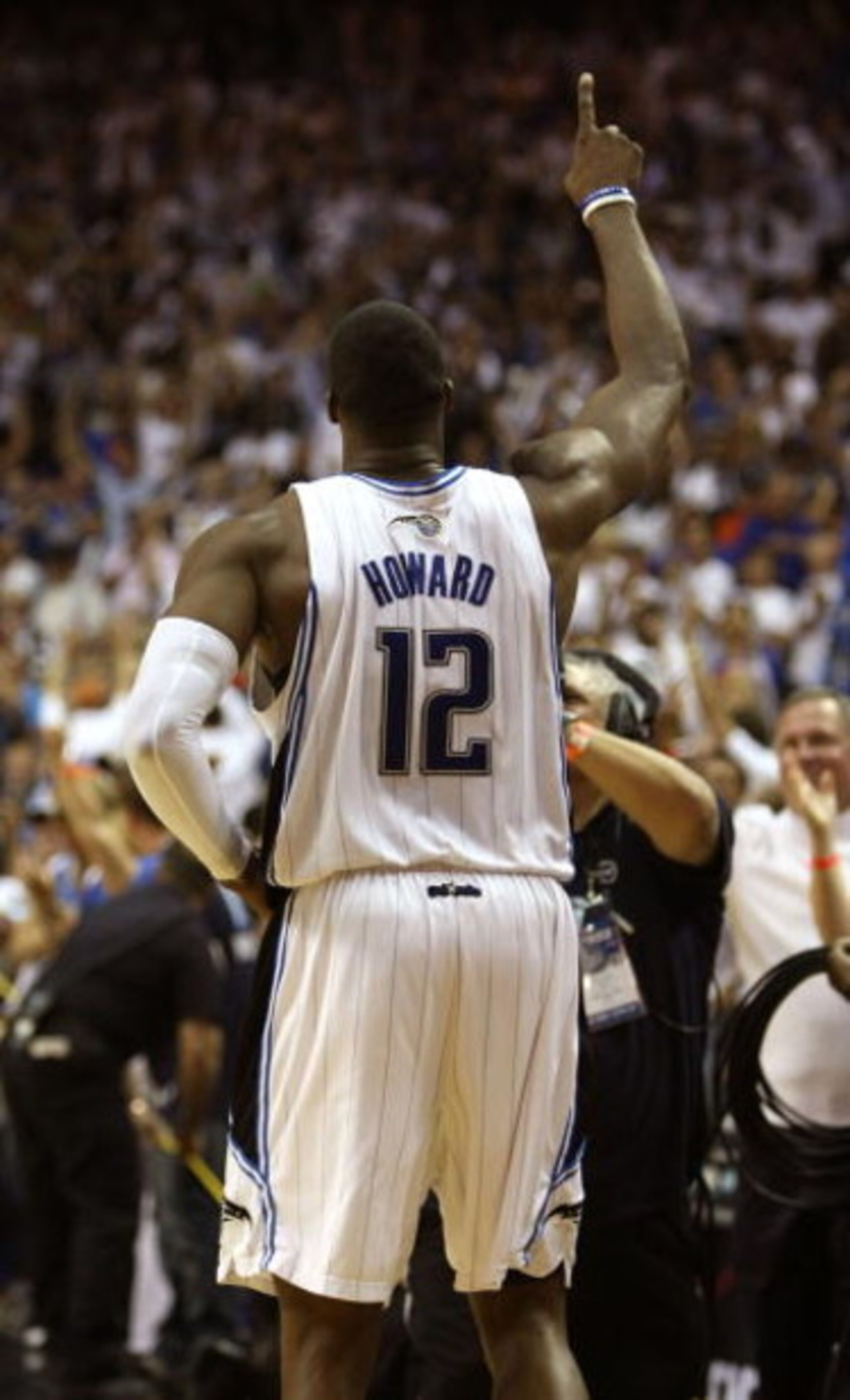 ORLANDO, FL - MAY 30:  Dwight Howard #12 of the Orlando Magic celebrates on the court after defeating the Cleveland Cavaliers in Game Six of the Eastern Conference Finals during the 2009 Playoffs at Amway Arena on May 30, 2009 in Orlando, Florida. NOTE TO