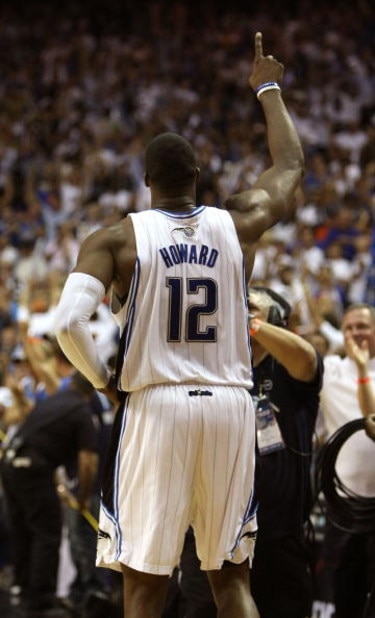ORLANDO, FL - MAY 30:  Dwight Howard #12 of the Orlando Magic celebrates on the court after defeating the Cleveland Cavaliers in Game Six of the Eastern Conference Finals during the 2009 Playoffs at Amway Arena on May 30, 2009 in Orlando, Florida. NOTE TO
