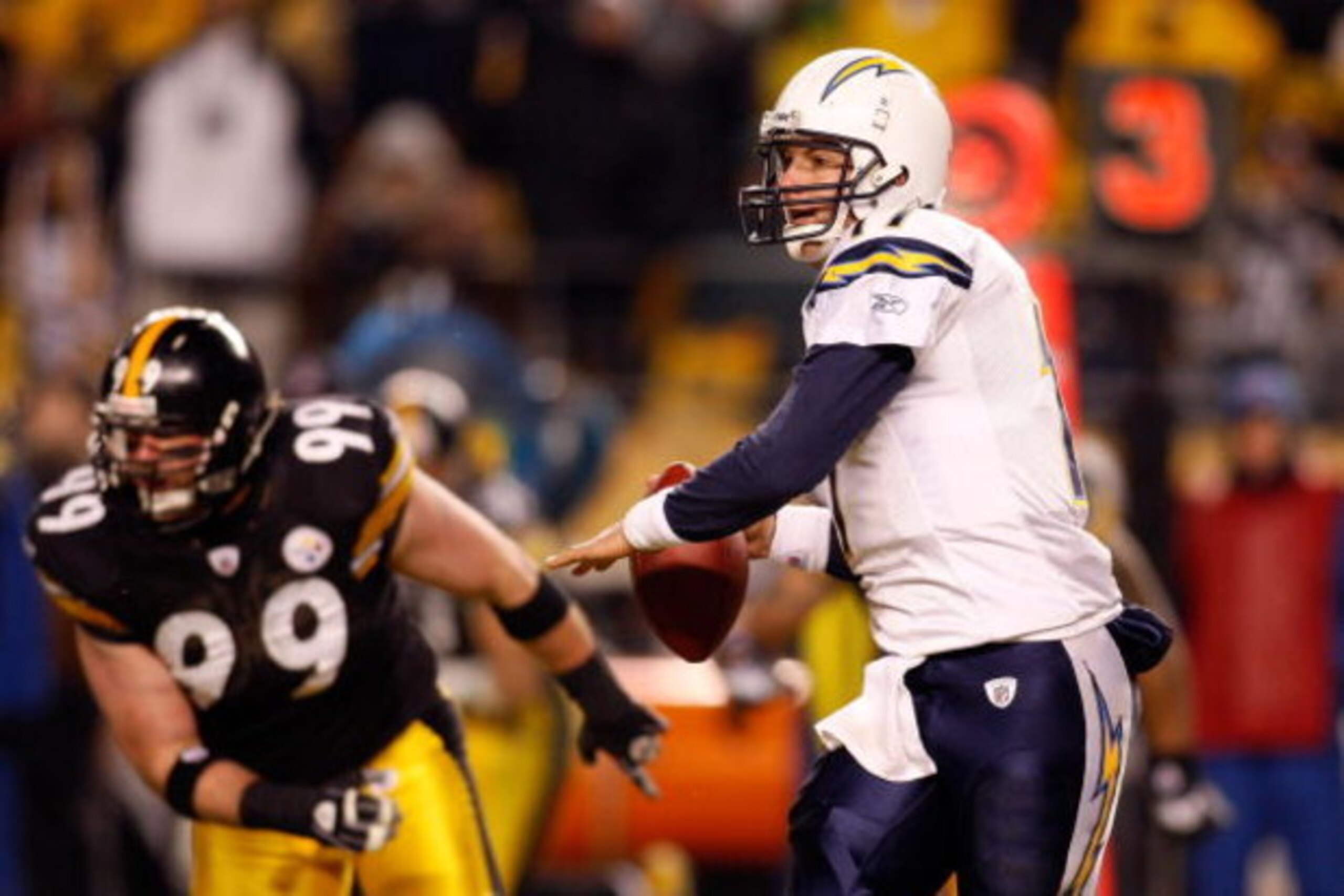 PITTSBURGH - JANUARY 11:  Philip Rivers #17 of the San Diego Chargers looks to pass against Brett Keisel #99 of the Pittsburgh Steelers during their AFC Divisional Playoff Game on January 11, 2009 at Heinz Field in Pittsburgh, Pennsylvania. Steelers won 3