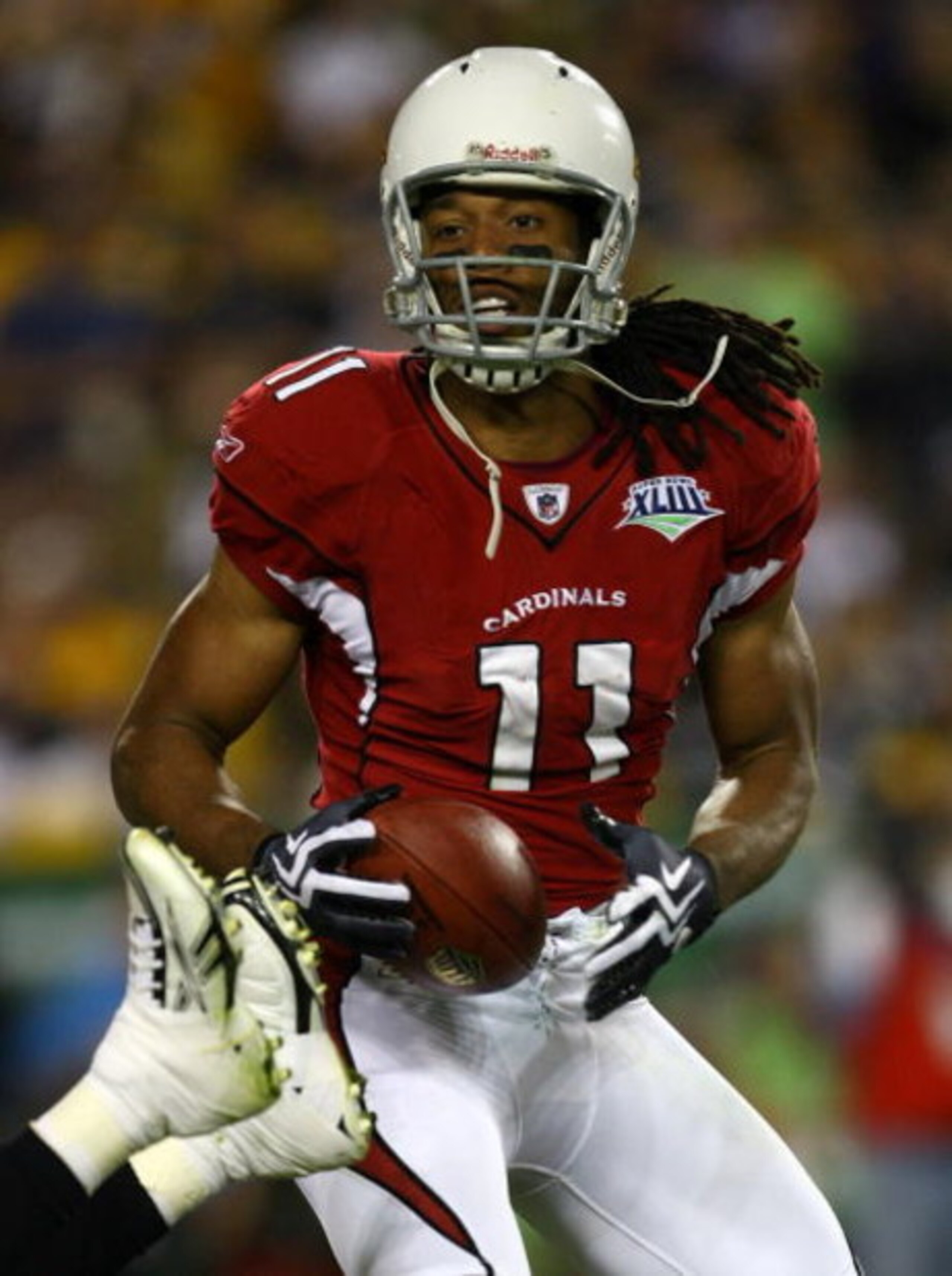 TAMPA, FL - FEBRUARY 01:  Larry Fitzgerald #11 of the Arizona Cardinals catches the ball against the Pittsburgh Steelers during Super Bowl XLIII on February 1, 2009 at Raymond James Stadium in Tampa, Florida.  (Photo by Jamie Squire/Getty Images)