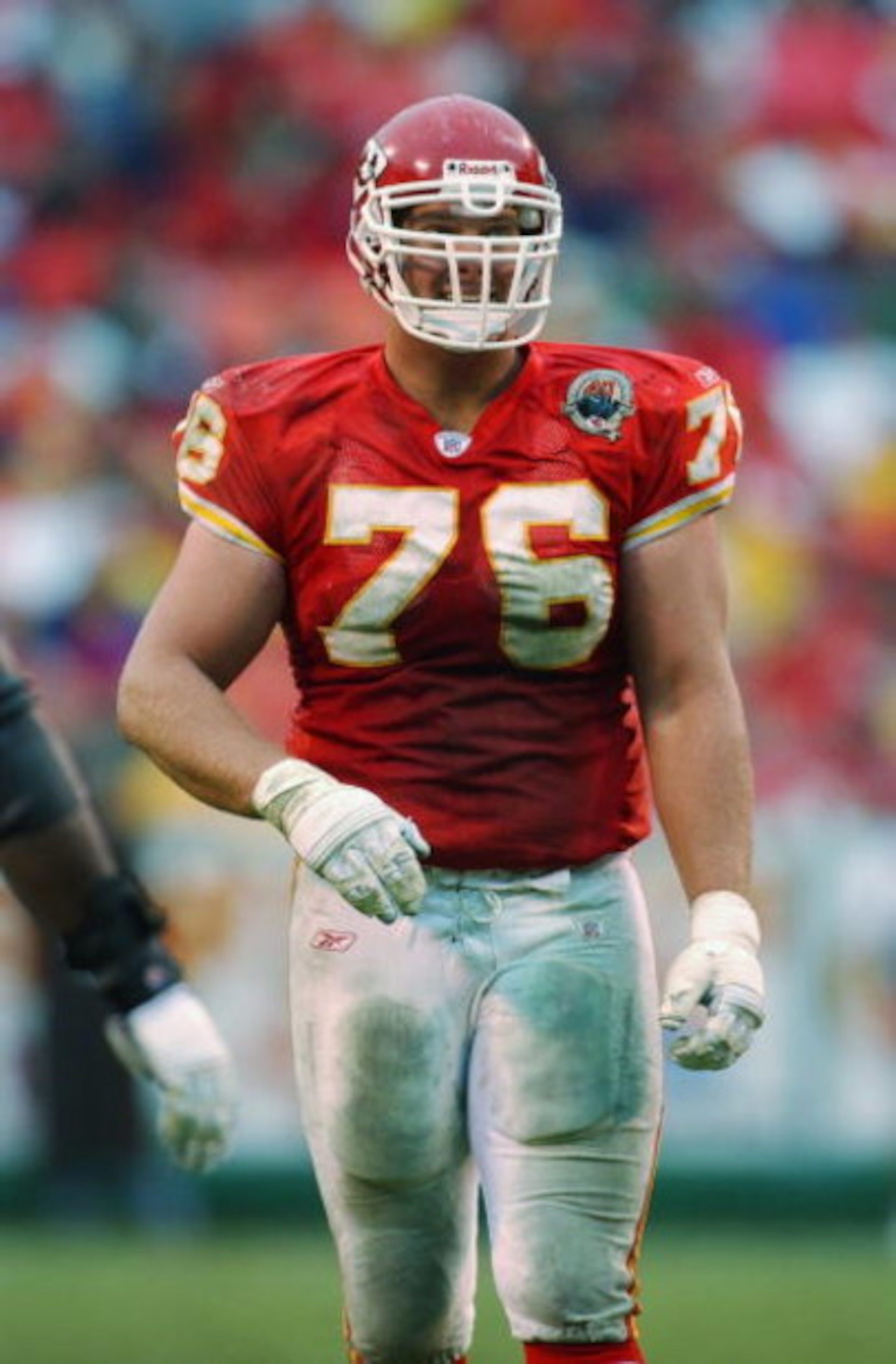 KANSAS CITY, MO - OCTOBER 27: Tackle John Tait #76 of the Kansas City Chiefs walks across the field during the NFL game against the Oakland Raiders at Arrowhead Stadium on October 27, 2002 in Kansas City, Missouri. The Chiefs defeated the Raiders 20-10 KANSAS CITY, MO - OCTOBER 27: Tackle John Tait #76 of the Kansas City Chiefs walks across the field during the NFL game against the Oakland Raiders at Arrowhead Stadium on October 27, 2002 in Kansas City, Missouri. The Chiefs defeated the Raiders 20-10