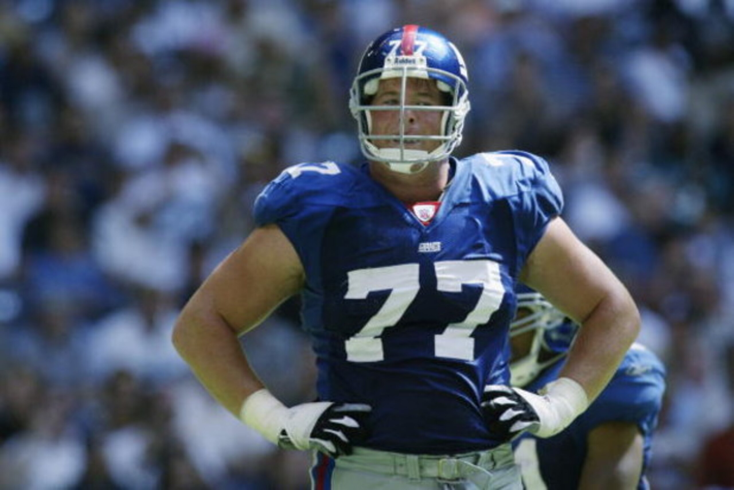 IRVING, TEXAS - OCTOBER 6: Tackle Luke Petitgout #77 of the New York Giants stands on the field during the NFL game against the Dallas Cowboys on October 6, 2002 at Texas Stadium in Irving, TX. The Giants defeated the Cowboys 21-17. (Photo by Ronald Ma IRVING, TEXAS - OCTOBER 6: Tackle Luke Petitgout #77 of the New York Giants stands on the field during the NFL game against the Dallas Cowboys on October 6, 2002 at Texas Stadium in Irving, TX. The Giants defeated the Cowboys 21-17. (Photo by Ronald Ma