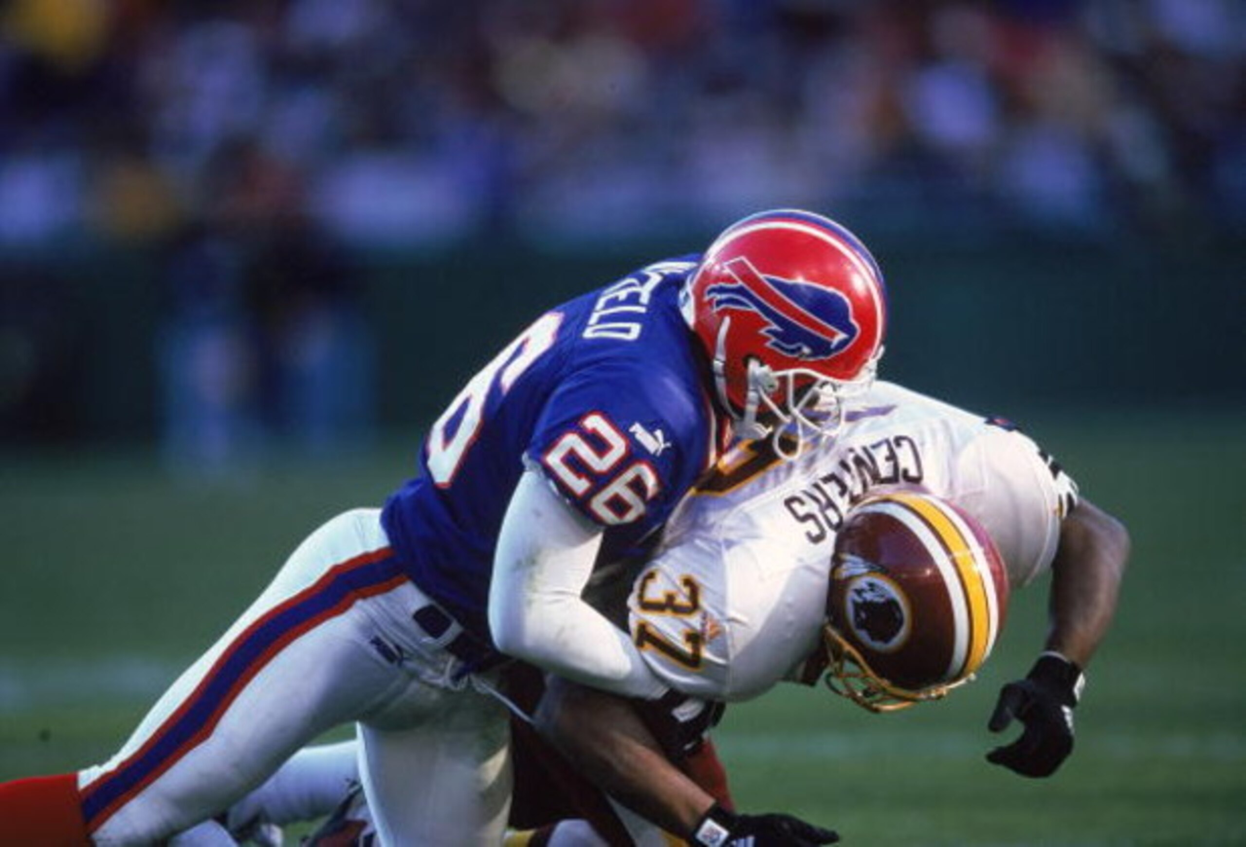7 Nov 1999: Antoine Winfield #26 of the Buffalo Bills tackles Larry Centers #37 of the Washington Redskins during the game at the Redskins Stadium in Landover, Maryland. The Bills defeated the Redskins 34-17. Mandatory Credit: Doug Pensinger /Allsport 7 Nov 1999: Antoine Winfield #26 of the Buffalo Bills tackles Larry Centers #37 of the Washington Redskins during the game at the Redskins Stadium in Landover, Maryland. The Bills defeated the Redskins 34-17. Mandatory Credit: Doug Pensinger /Allsport