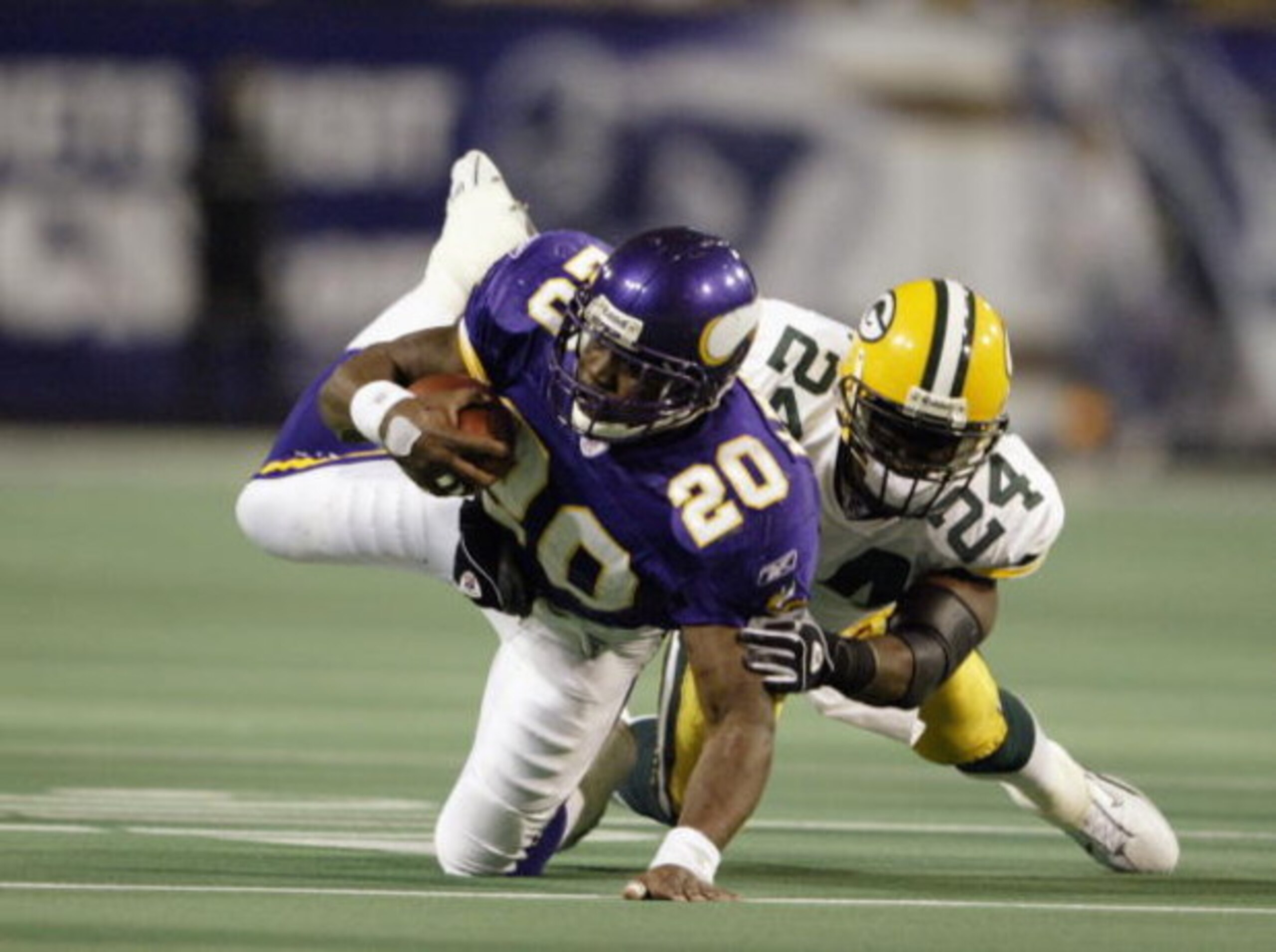 MINNEAPOLIS - NOVEMBER 2: Running back Moe Williams #20 of the Minnesota Vikings is tackled by safety Antuan Edwards #24 of the Green Bay Packers during the game at the Hubert H. Humphrey Metrodome on November 2, 2003 in Minneapolis, Minnesota. The Green MINNEAPOLIS - NOVEMBER 2: Running back Moe Williams #20 of the Minnesota Vikings is tackled by safety Antuan Edwards #24 of the Green Bay Packers during the game at the Hubert H. Humphrey Metrodome on November 2, 2003 in Minneapolis, Minnesota. The Green