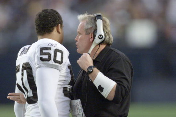 15 Dec 2001:   Chuck Bresnahan defensive coordinator for the Oakland Raiders talks with linebacker Eric Barton #50  during their game at Qualcomm Stadium in San Diego, California.  The Raiders won 13-6. DIGITAL IMAGE   Mandatory Credit:  Stephen Dunn/ALLS